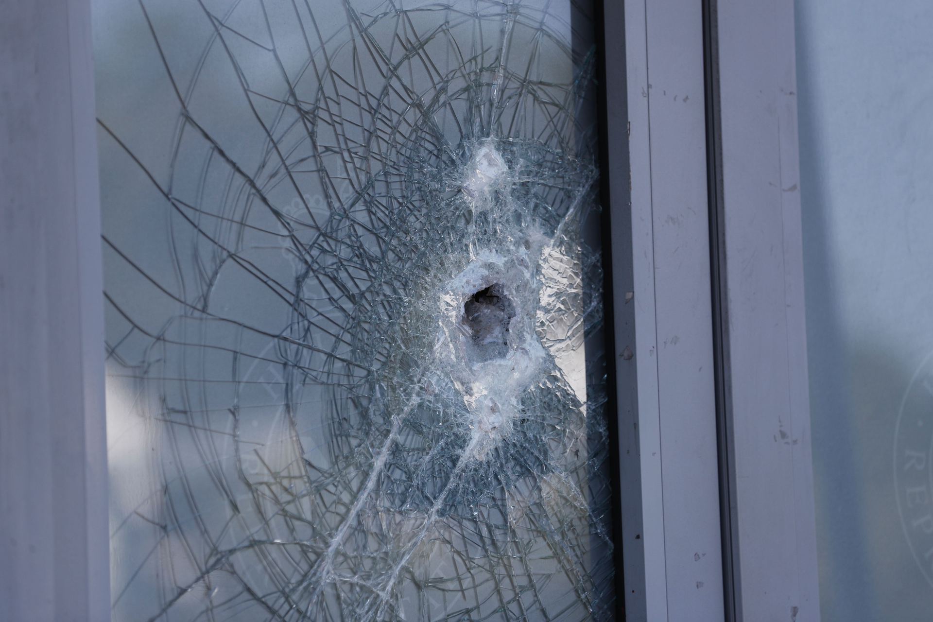 The front door was smashed in an attack on the Prime Minister's Mt Albert electorate office. Photo / Dean Purcell