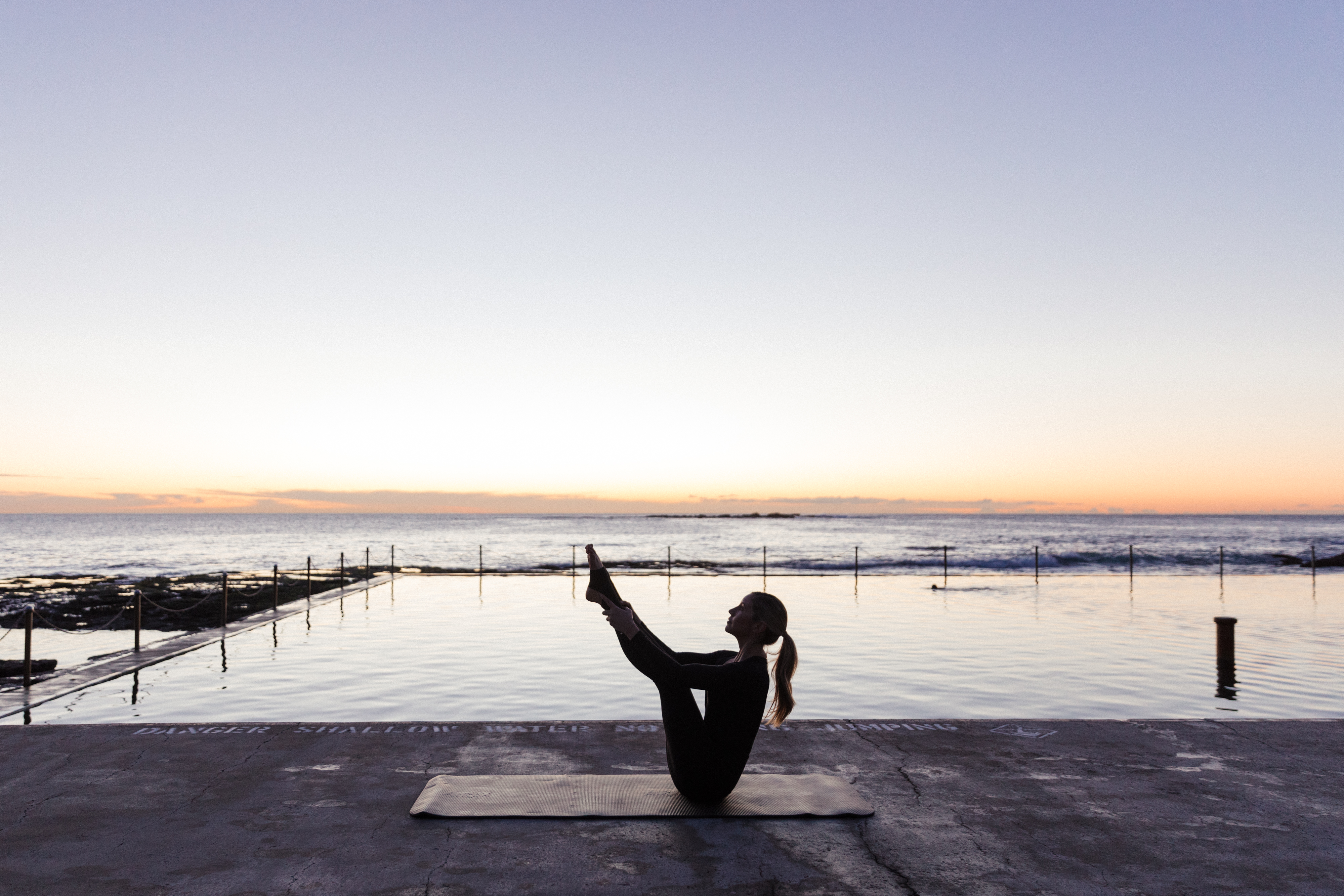 Kirsten King, founder of Fluidform Pilates, proves you can take your mat practice with you anywhere. Photo / Supplied