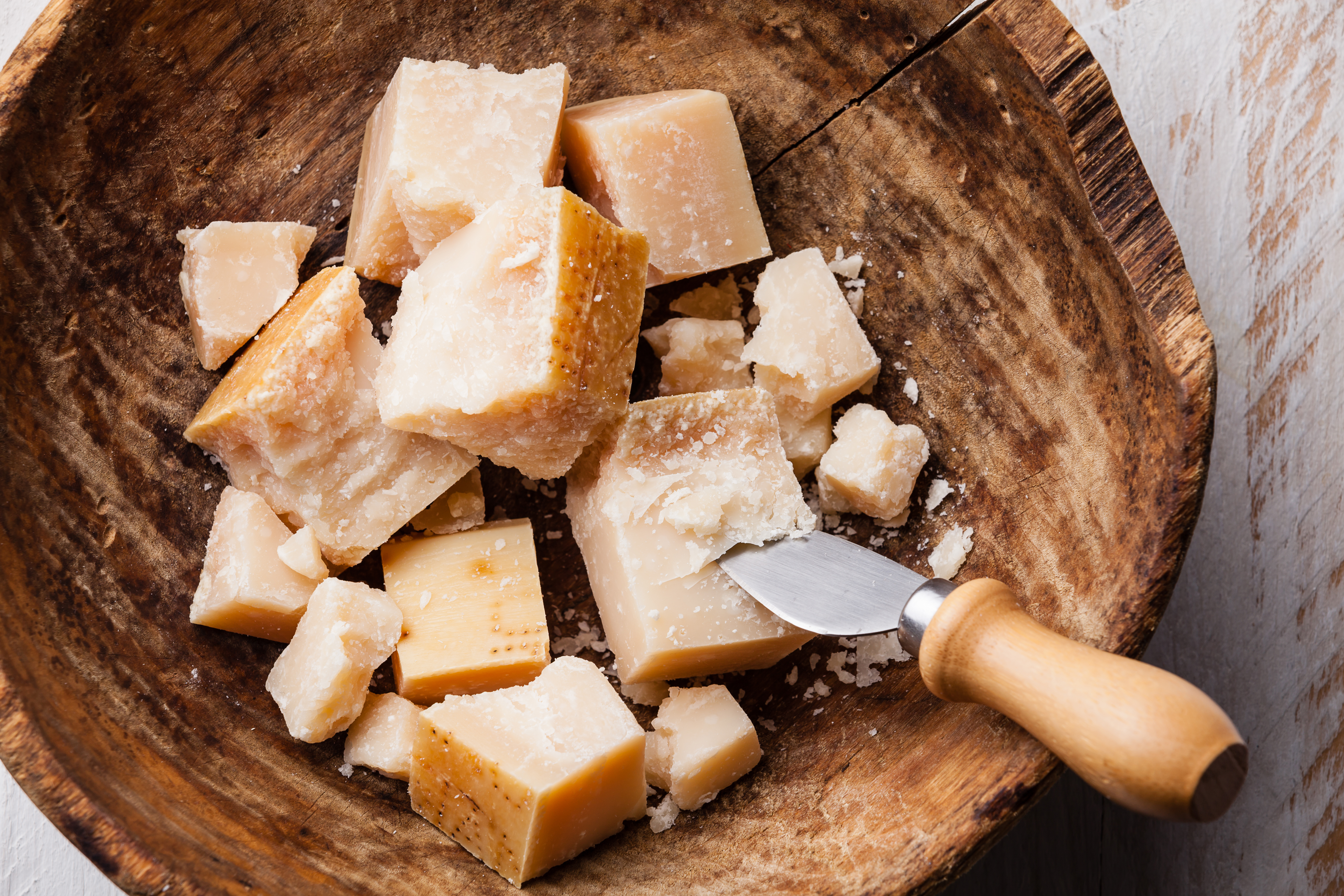 Mould can't penetrate harder cheeses such as parmesan and cheddar. Photo / Getty Images
