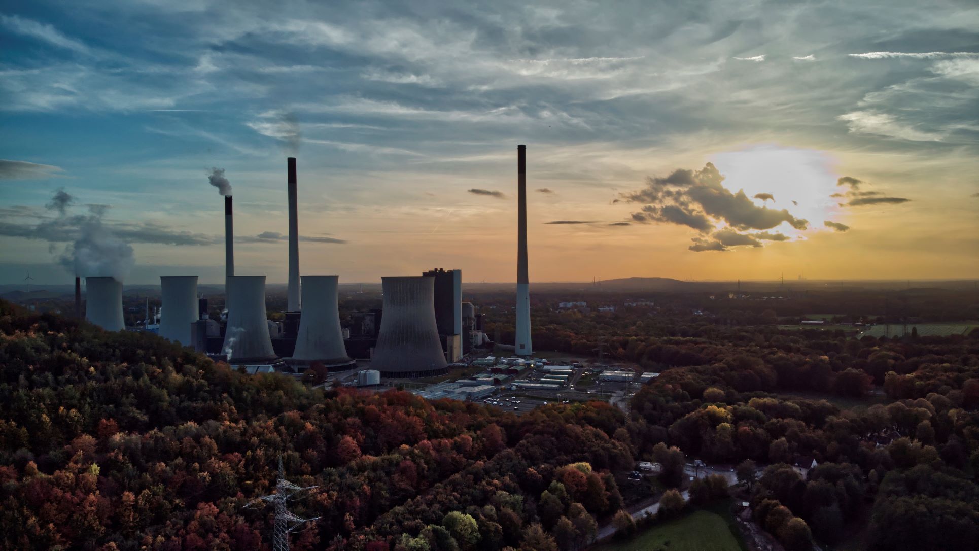 The sun sets behind a coal-fired power plant in Gelsenkirchen, Germany, this month. A new climate action report by the UN says the world is not acting fast enough to reduce harmful emissions. Photo / AP