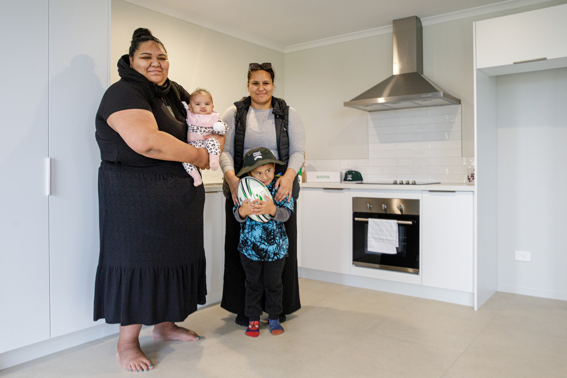 First-home owner Hariata Ngatai (left) with her sister Hinemaui Parata, niece and nephew. Photo / Mead Norton