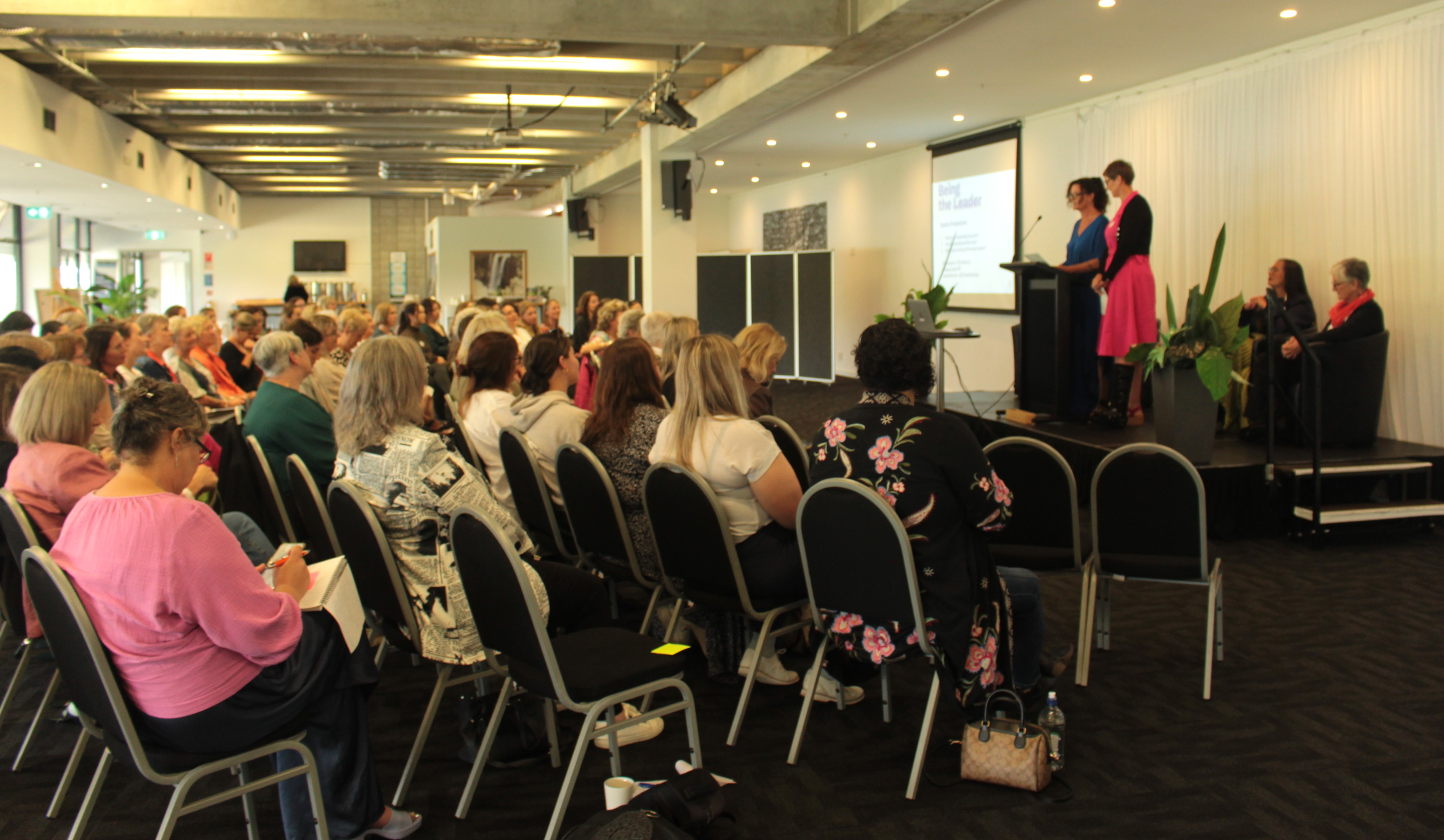 Leading Ladies Northland co-ordinator Tania McInnes introduces Fiona Bycroft to the group of 90 attendees. Photo / Denise Piper