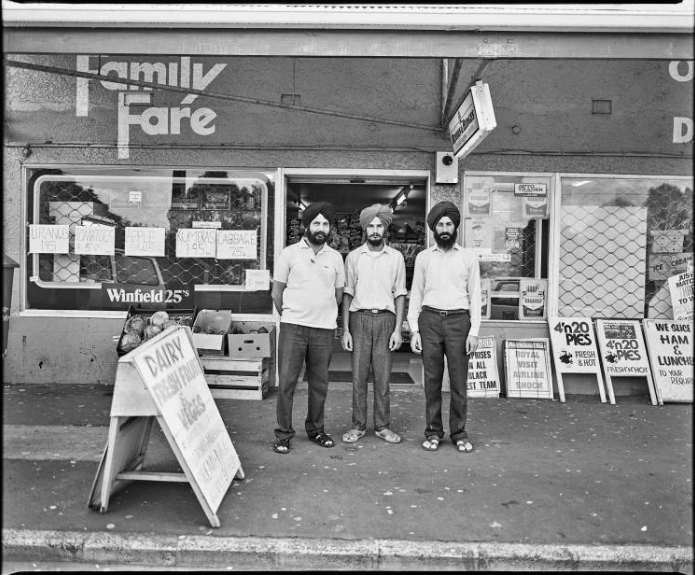 Dairy owner Nanjit Singh Mann and his staff outside the dairy at 91 Tripoli Road in Panmure, 1989. Photo / Auckland Libraries Heritage Collections