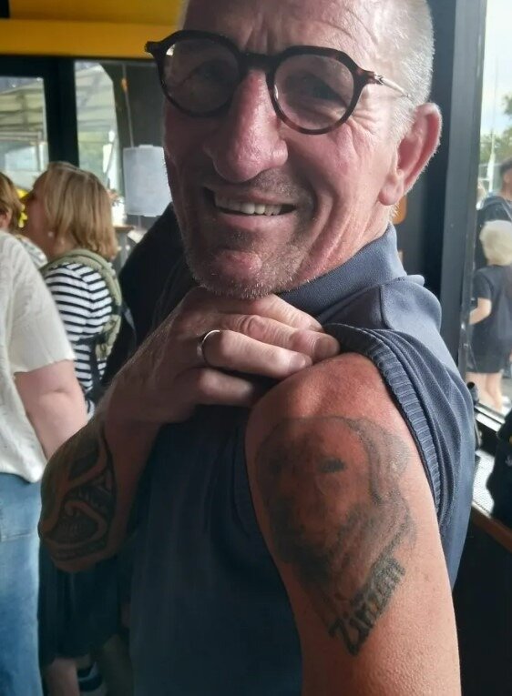 Hans Marcker, who played in the Netherlands' 1989 sevens team, shows a tattoo commemorating a dog he named after All Black Zinzan Brooke. Photo / Adam Julian