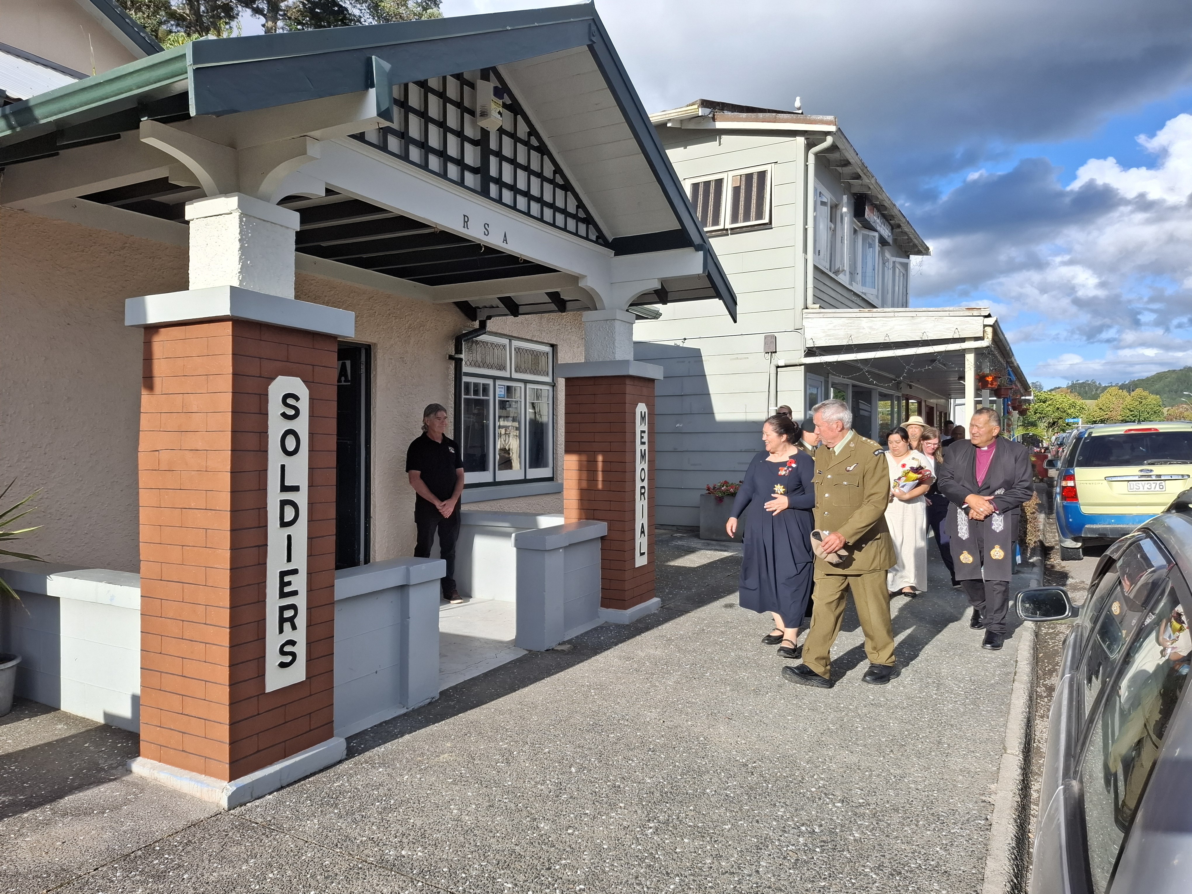 Capt (retired) Rev. Kevin Herewini, President of Whangaroa RSA, escorts Dame Cindy Kiro into the Whangaroa RSA building in Kāeo that is being refurbished ahead of its 100th anniversary on Anzac Day.