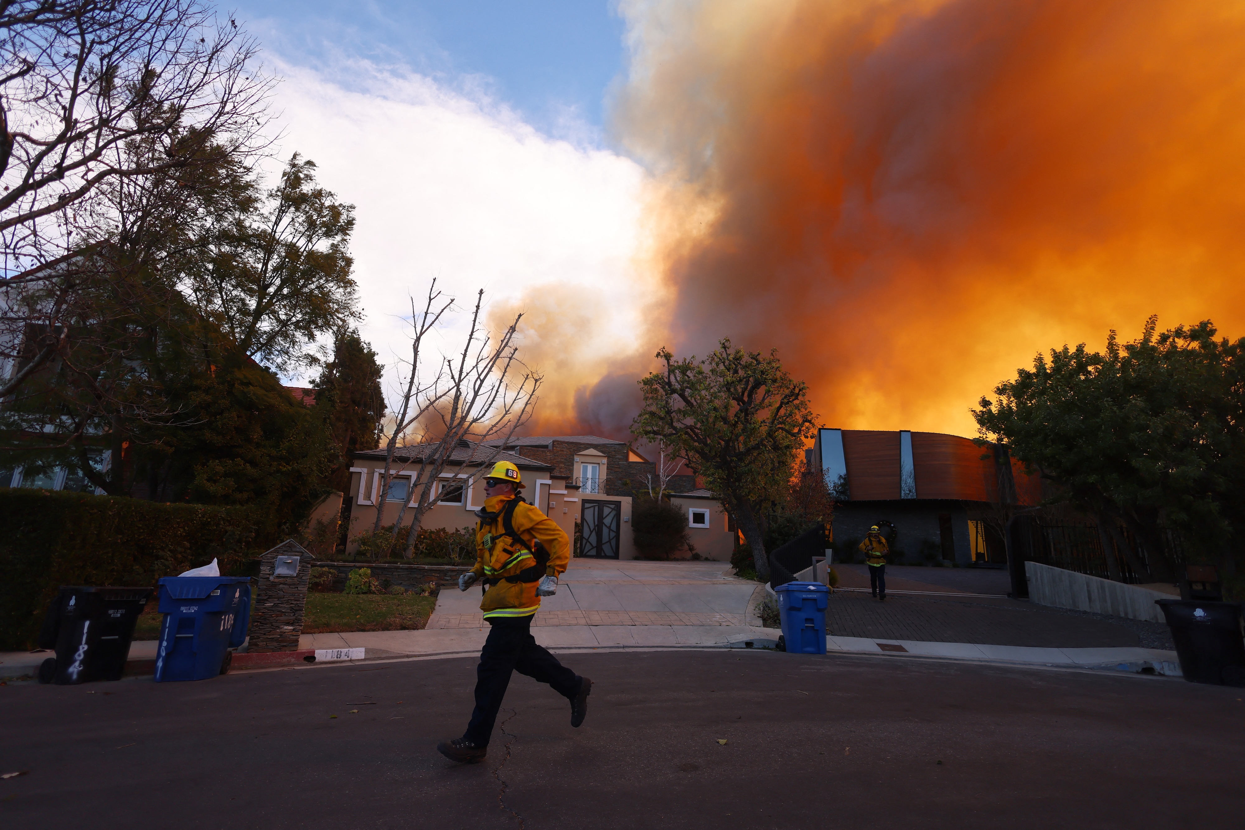 Firefighters on the scene as flames take hold in Pacific Palisades. Photo / AFP