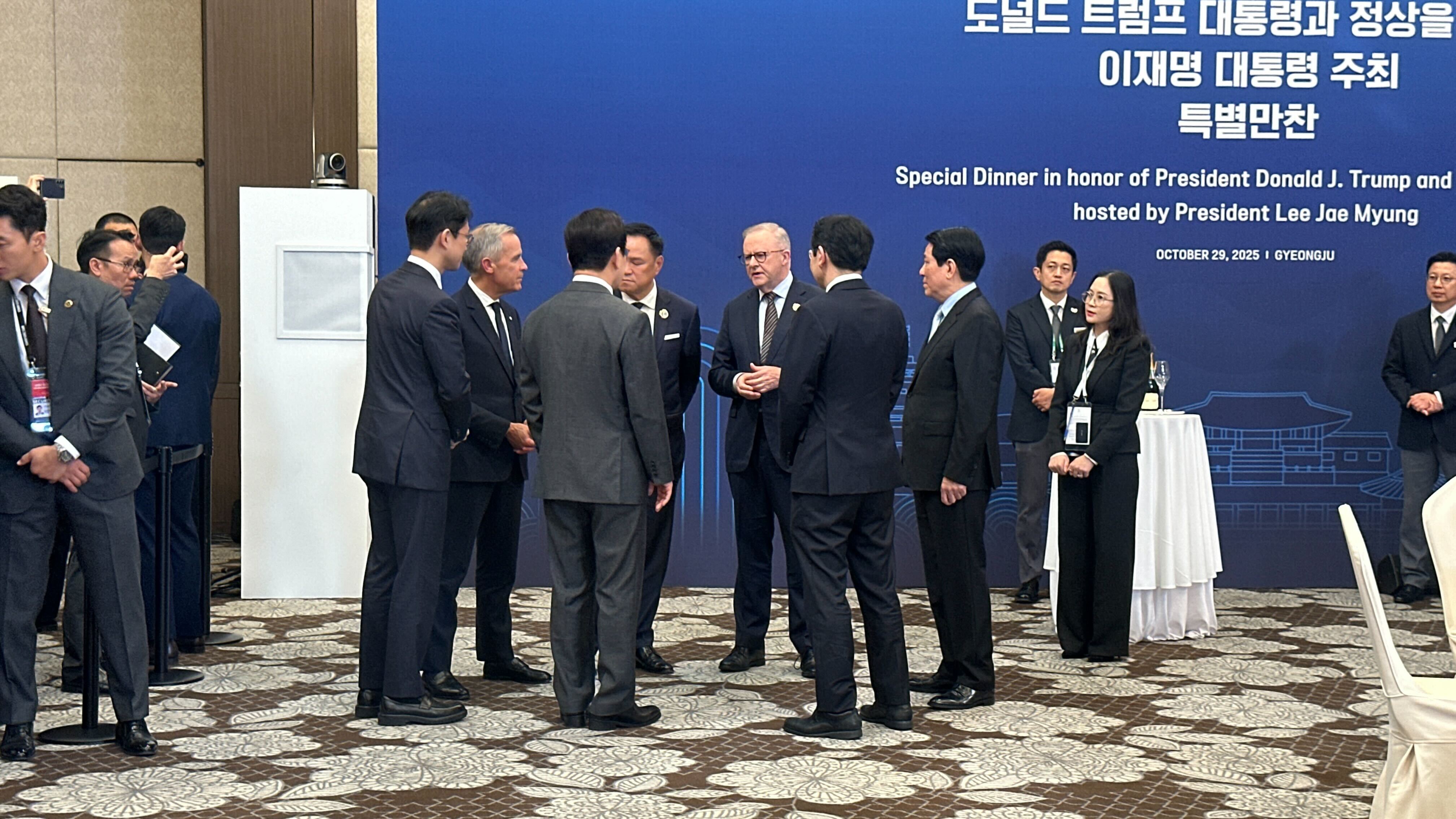 World leaders huddled in a corner while they awaited Christopher Luxon and Donald Trump. Photo / Jamie Ensor/Pool