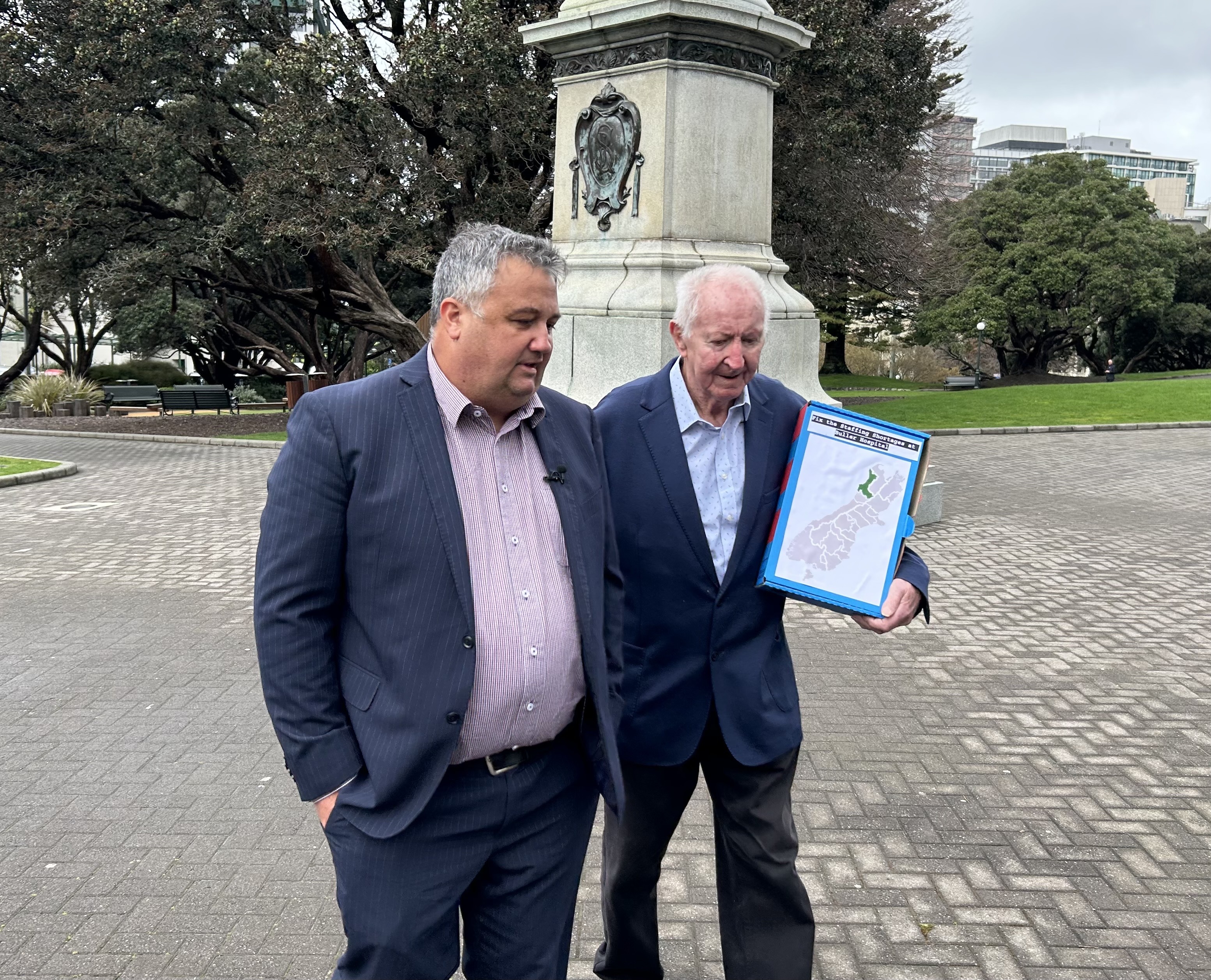 Patient Voice Aotearoa chairman Malcolm Mulholland (left) and father George, who hail from Buller, deliver a petition at Parliament urging MPs to act urgently to address the dire state of Buller healthcare. Photo / Adam Pearse