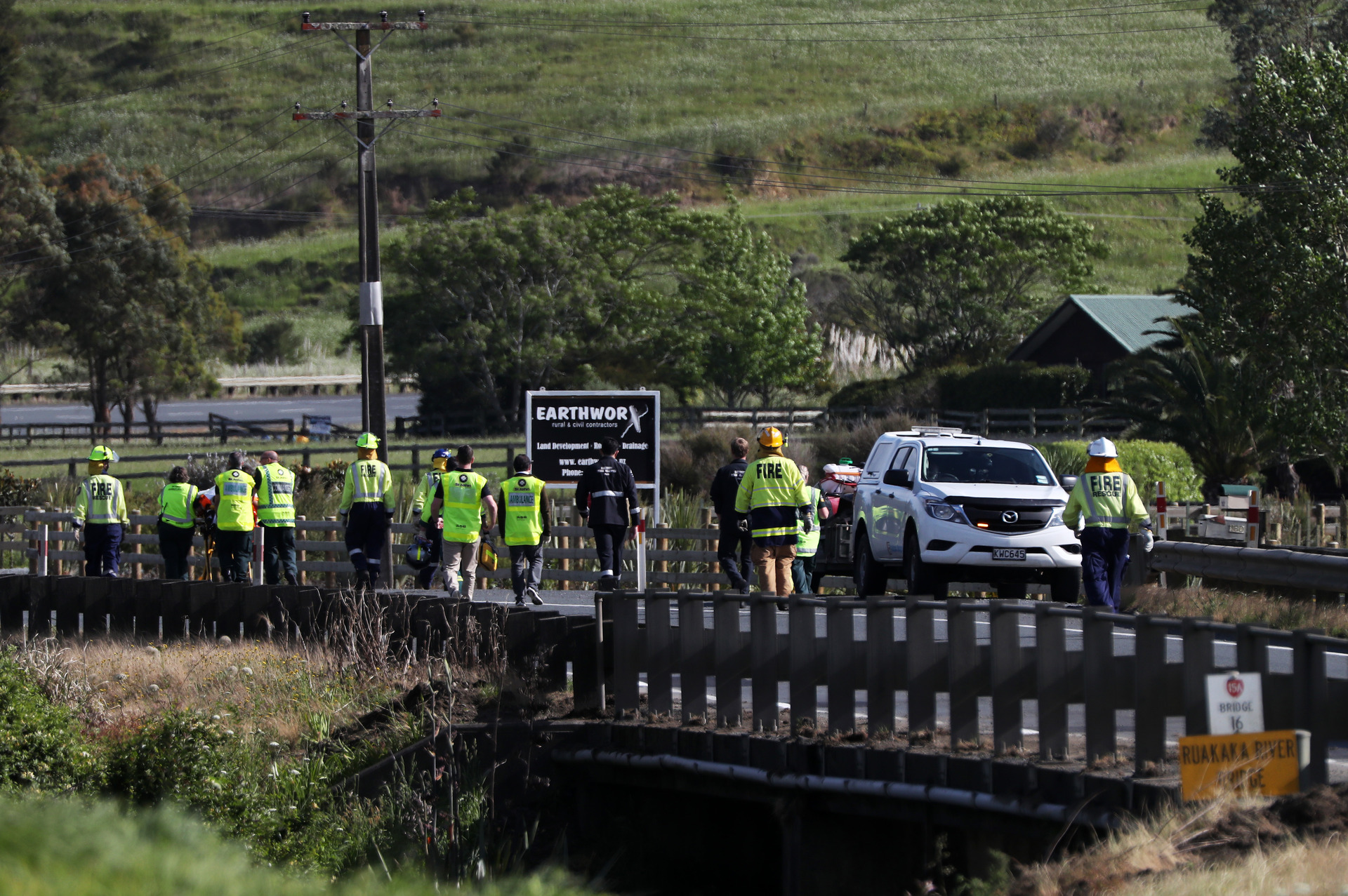 Emergency services transporting injured person away from the scene. 