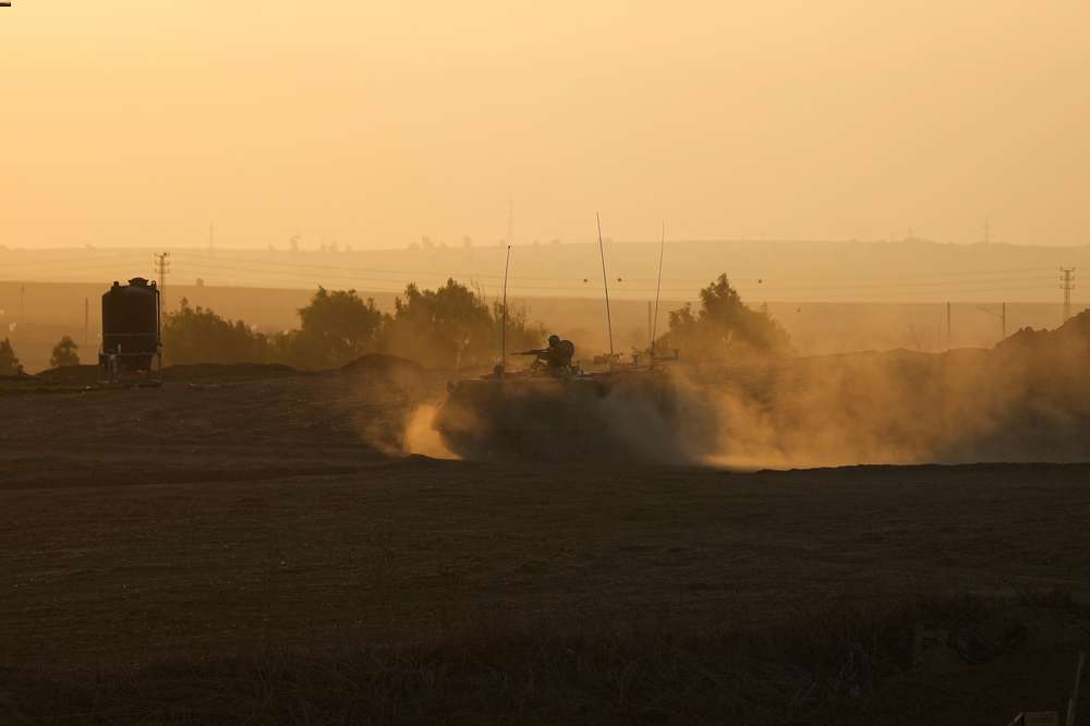 An Israeli armoured personnel carrier moves near the Gaza Strip border in southern Israel. Photo / AP