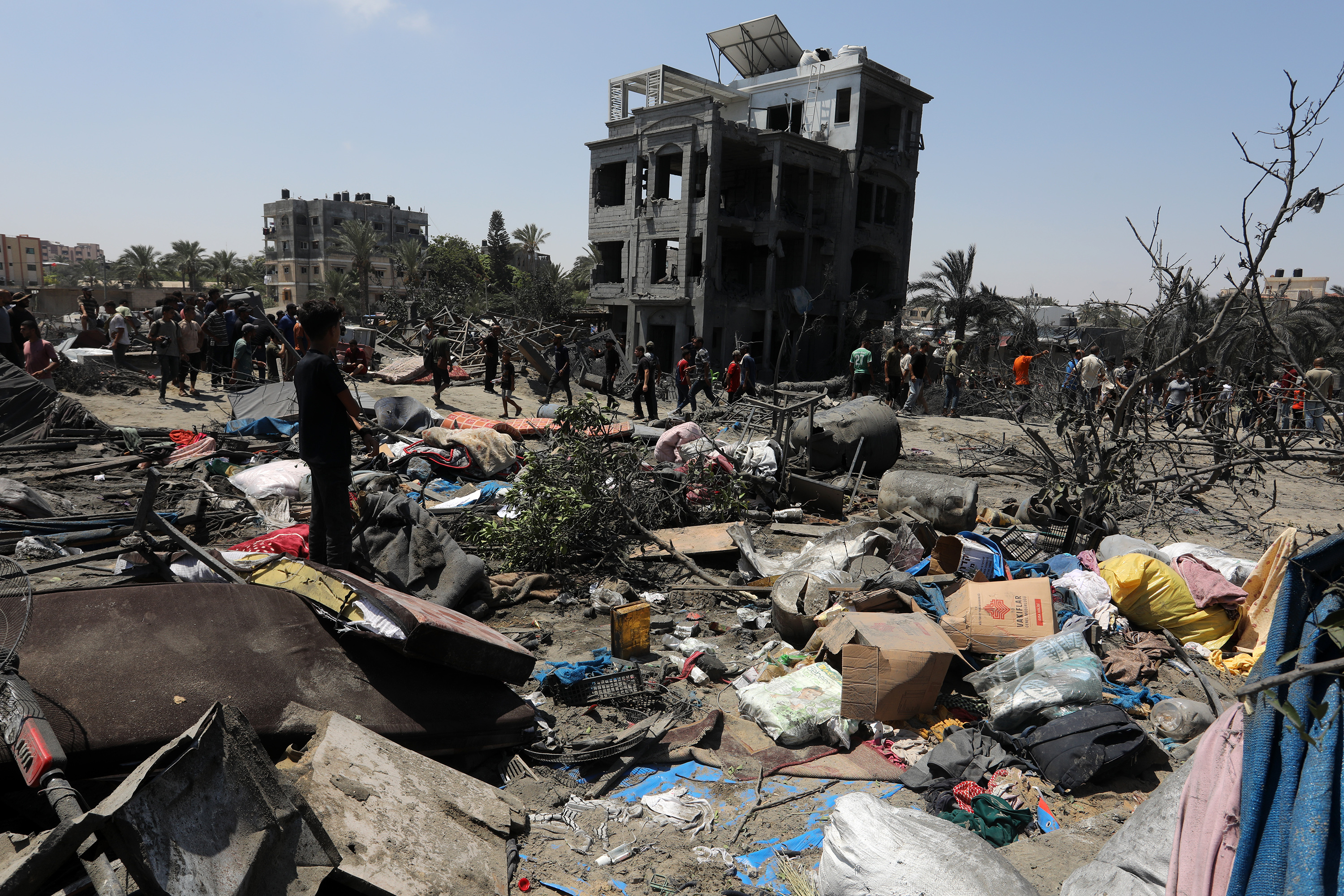 Palestinians inspect the area after an Israeli attack hits displaced people's camps in Al-Mawasi area of Khan Yunis, Gaza on July 13, 2024. Photo / Anadolu via Getty Images