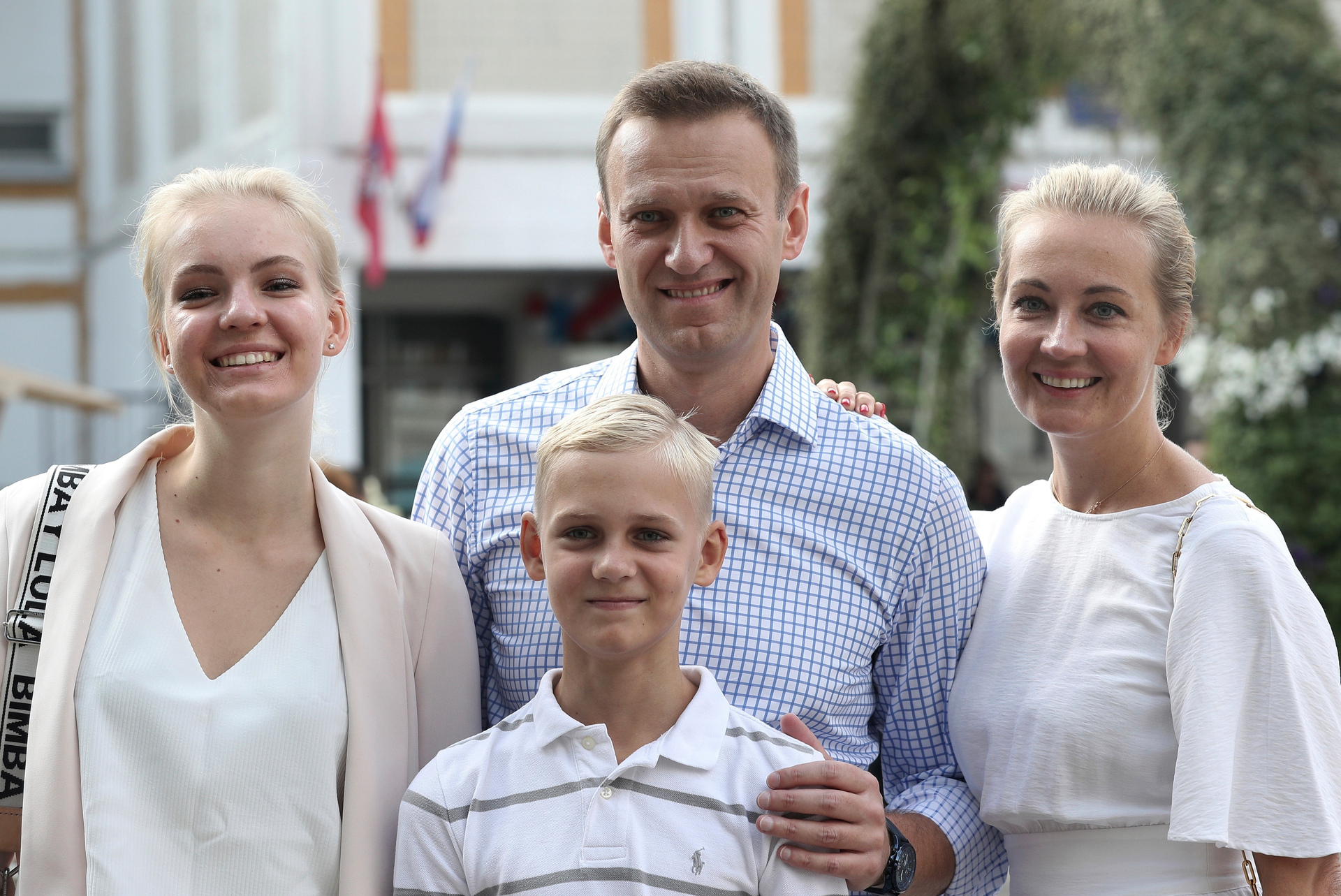 Russian opposition leader Alexei Navalny, with his wife Yulia, right, daughter Daria, and son Zakhar pose for the media after voting during a city council election in Moscow in 2019. Photo / AP