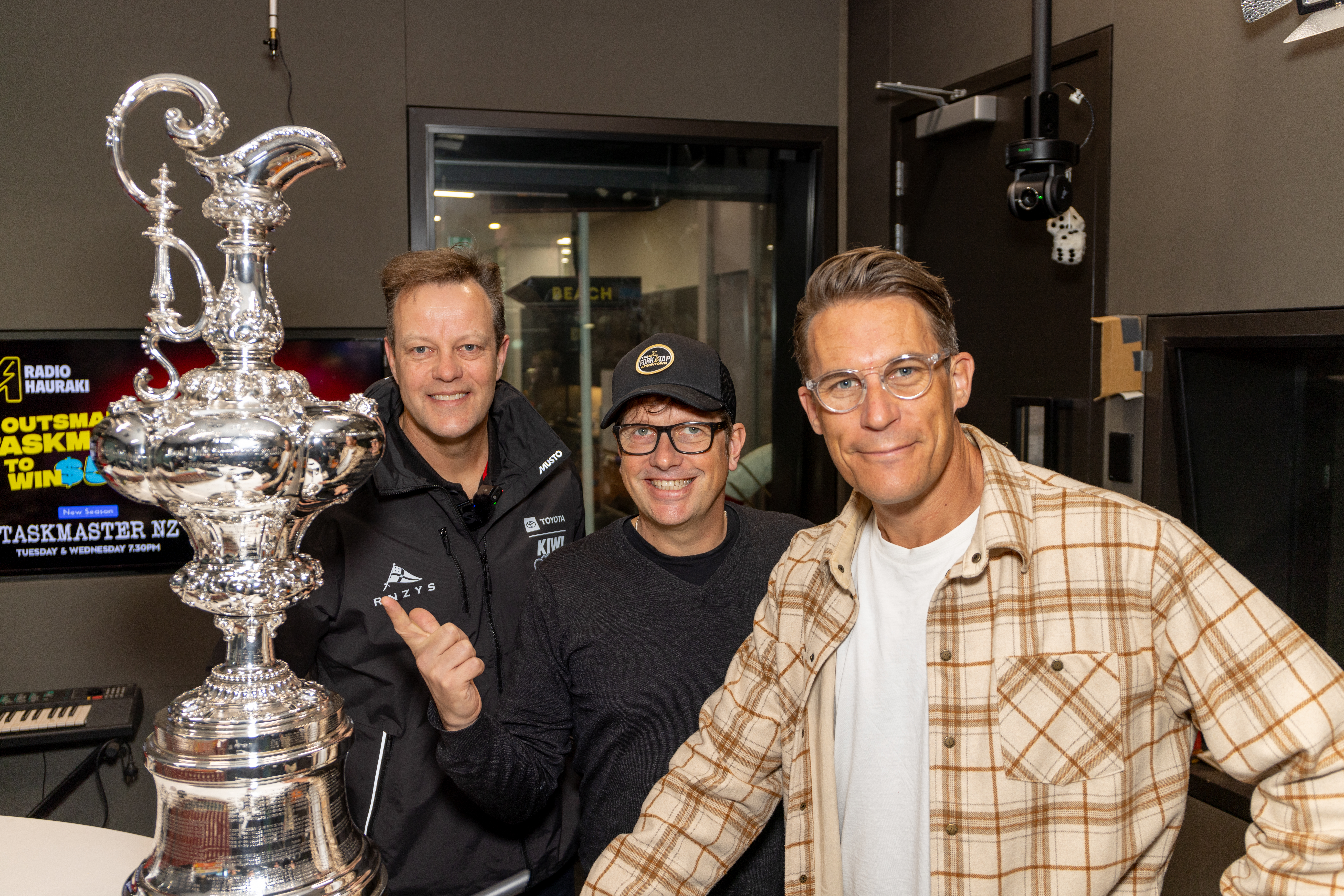 Royal New Zealand Yacht Squadron rear commodore David Blakey with Matt Heath and Jeremy Wells from Radio Hauraki's Matt and Jerry Show. Photo / Suellen Hurling, Live Sail Die for RNZYS