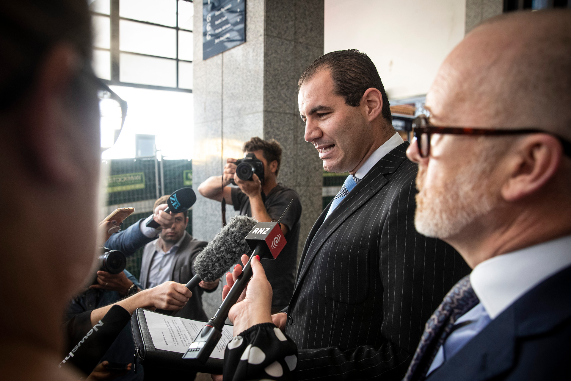 Jami-Lee Ross, next to his lawyer Ron Mansfield, outside the Auckland District Court where he said there had been