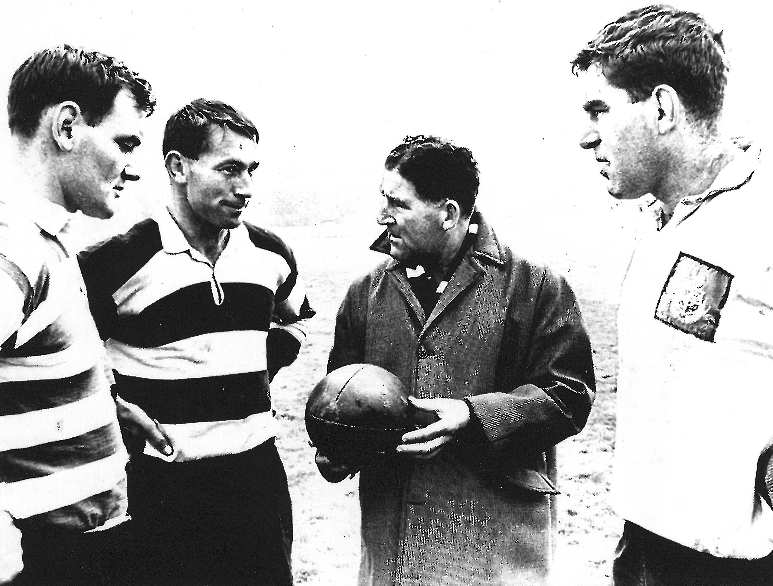 Brian Lochore, Kel Tremain, coach Fred Allen and Colin Meads talk tactics during the 1967 Northern Hemisphere tour. Photo / Supplied