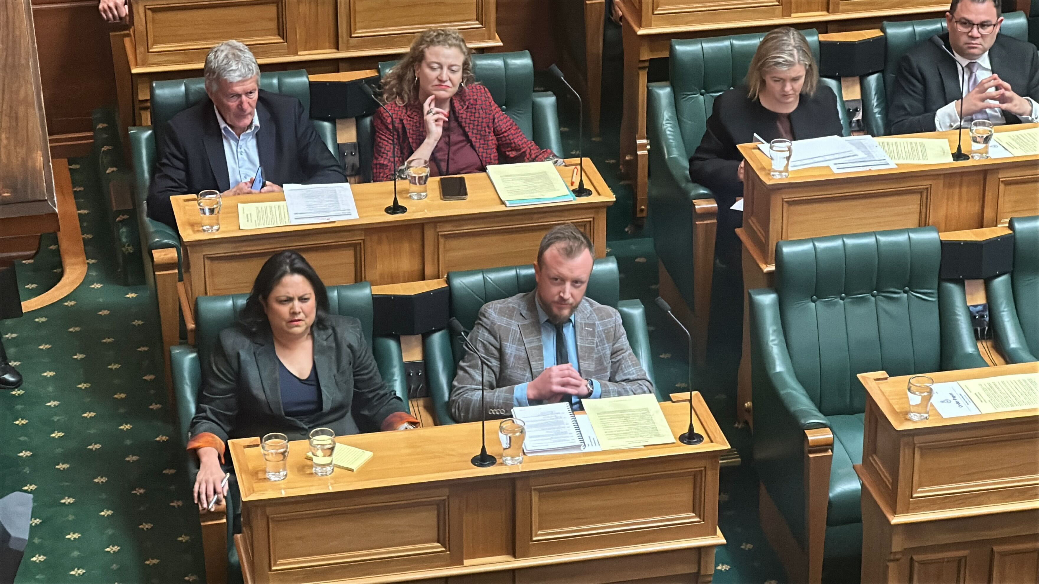 Labour's Ayesha Verrall (left) and Kieran McAnulty on the front bench listen to Winston Peters and Gerry Brownlee after Peters made his allegation. Photo / Jamie Ensor