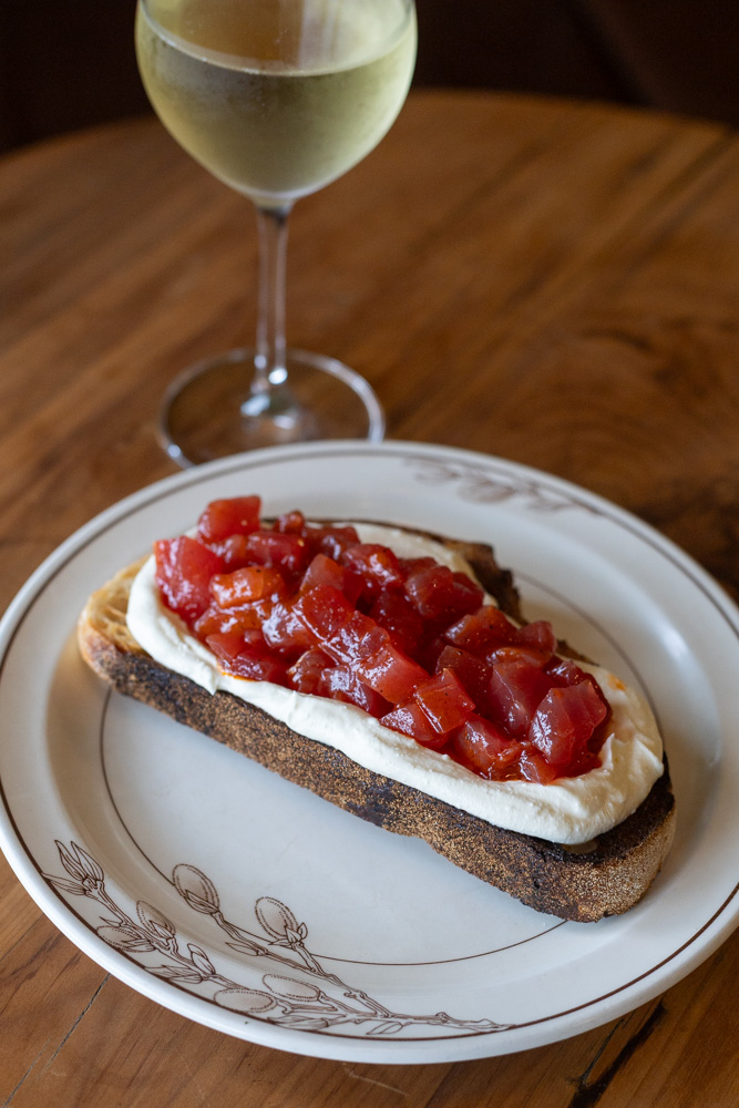 Raw tuna, fermented capsicum and buffalo curd on sourdough. Photo / Jason Dorday