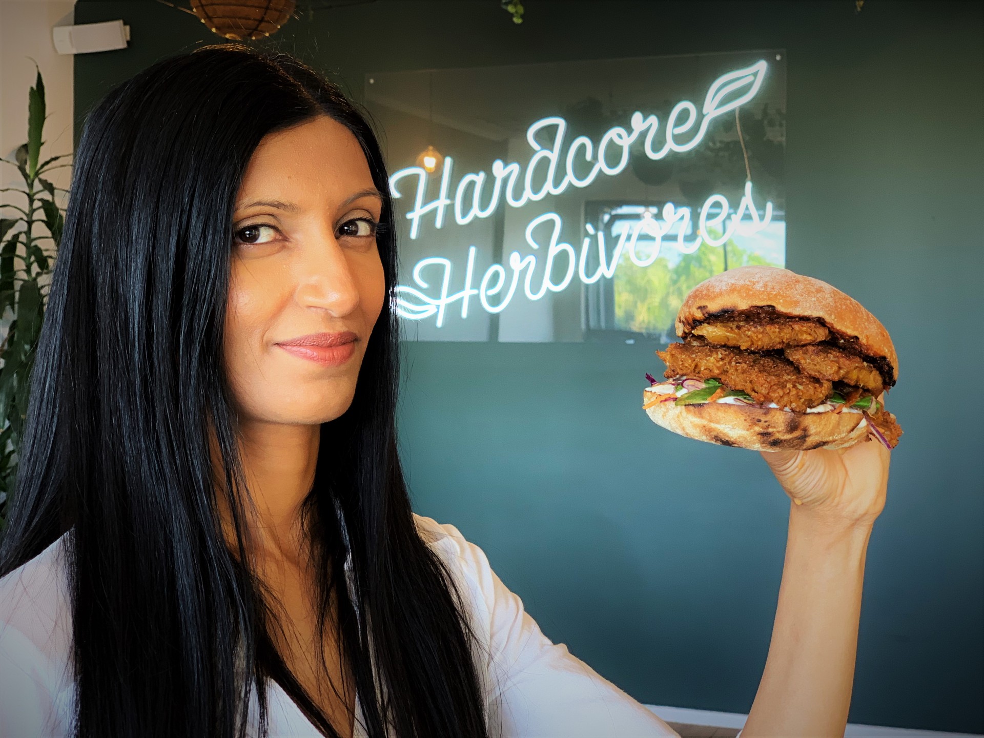 Sunfed Foods co-founder Shama Sukul Lee with a burger featuring the company's chickpea-based 