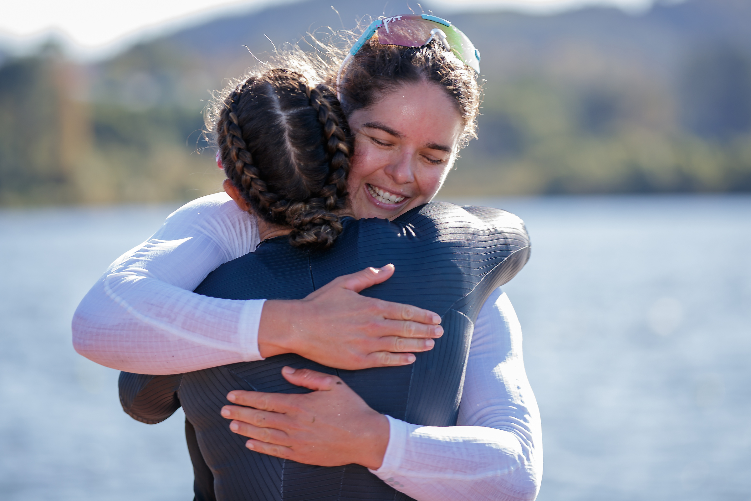 Lisa Carrington (left) and Aimee Fisher embrace after a women's K1 500m world championship qualification race at Lake Karapiro in April 2022. Photo / Photosport