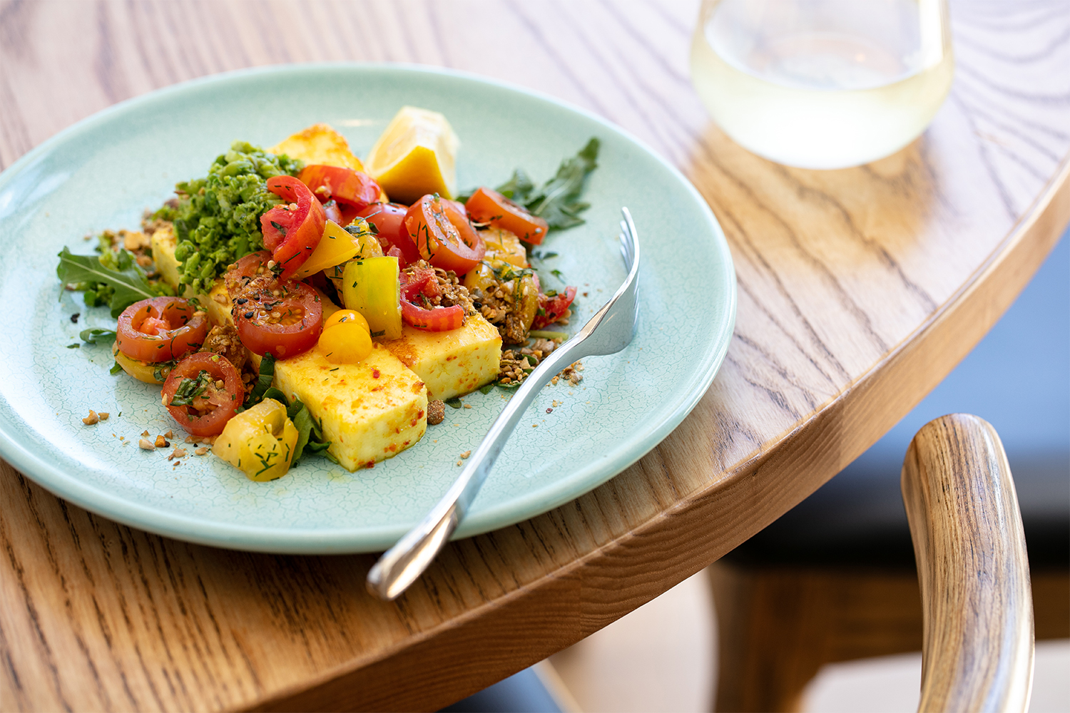 Spiced paneer with cherry tomatoes and herbs. Photo / Babiche Martens