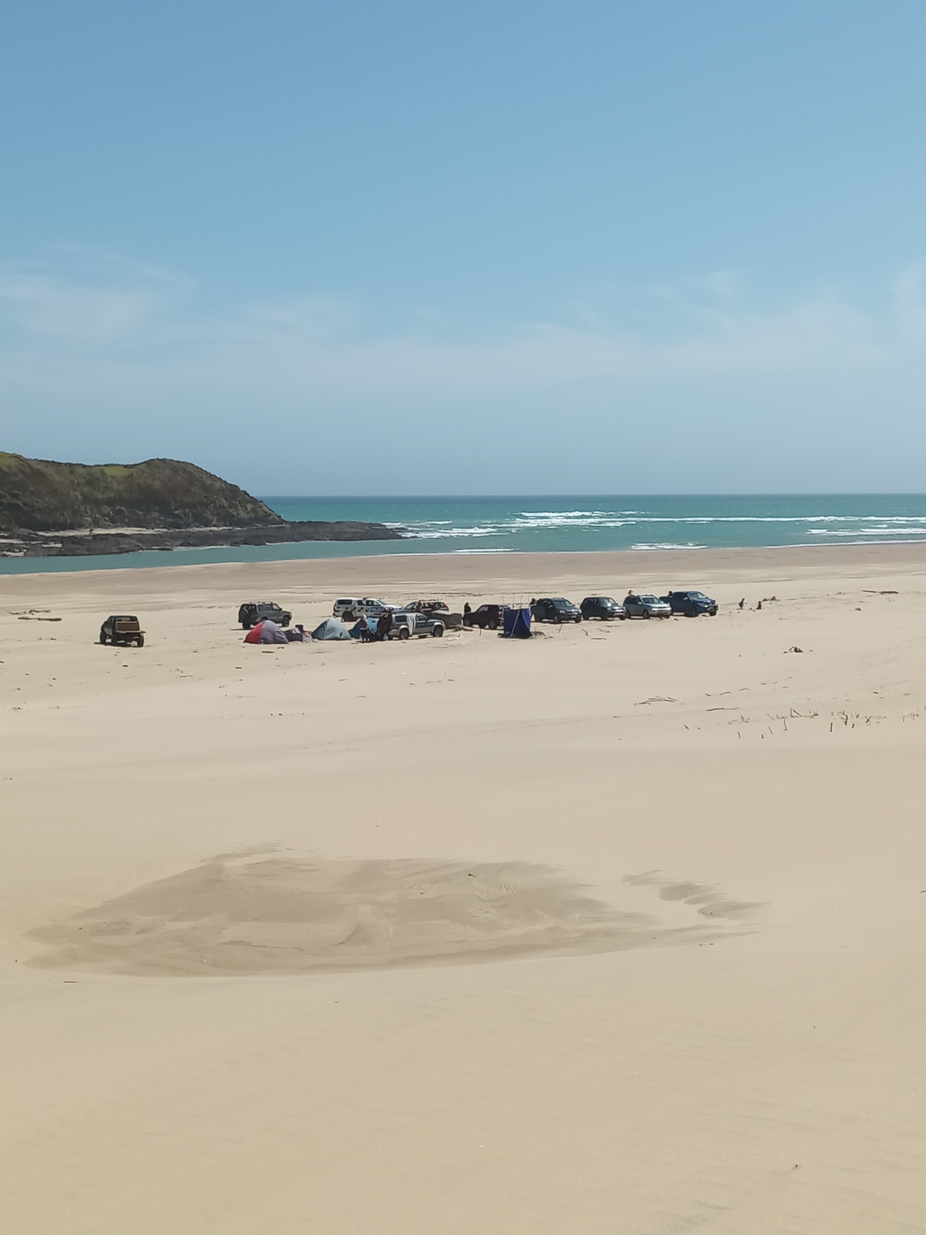 Search and rescuers gather at Herekino Harbour as they look for the missing 18-year-old diver