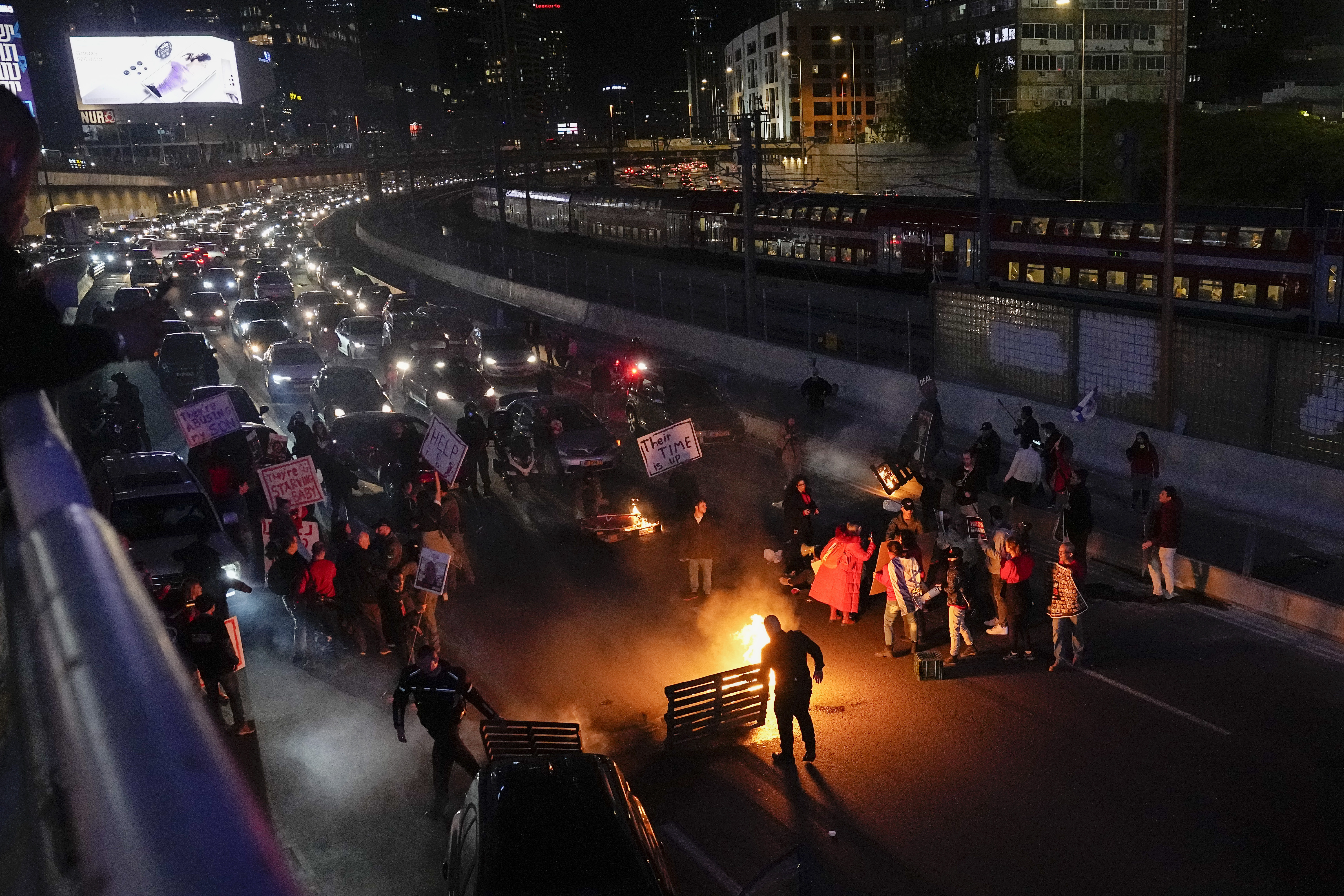 People block a highway during a protest to demand the release of the hostages taken by Hamas militants into the Gaza Strip during the October 7, 2023 attack, in Tel Aviv, Israel. Photo / AP