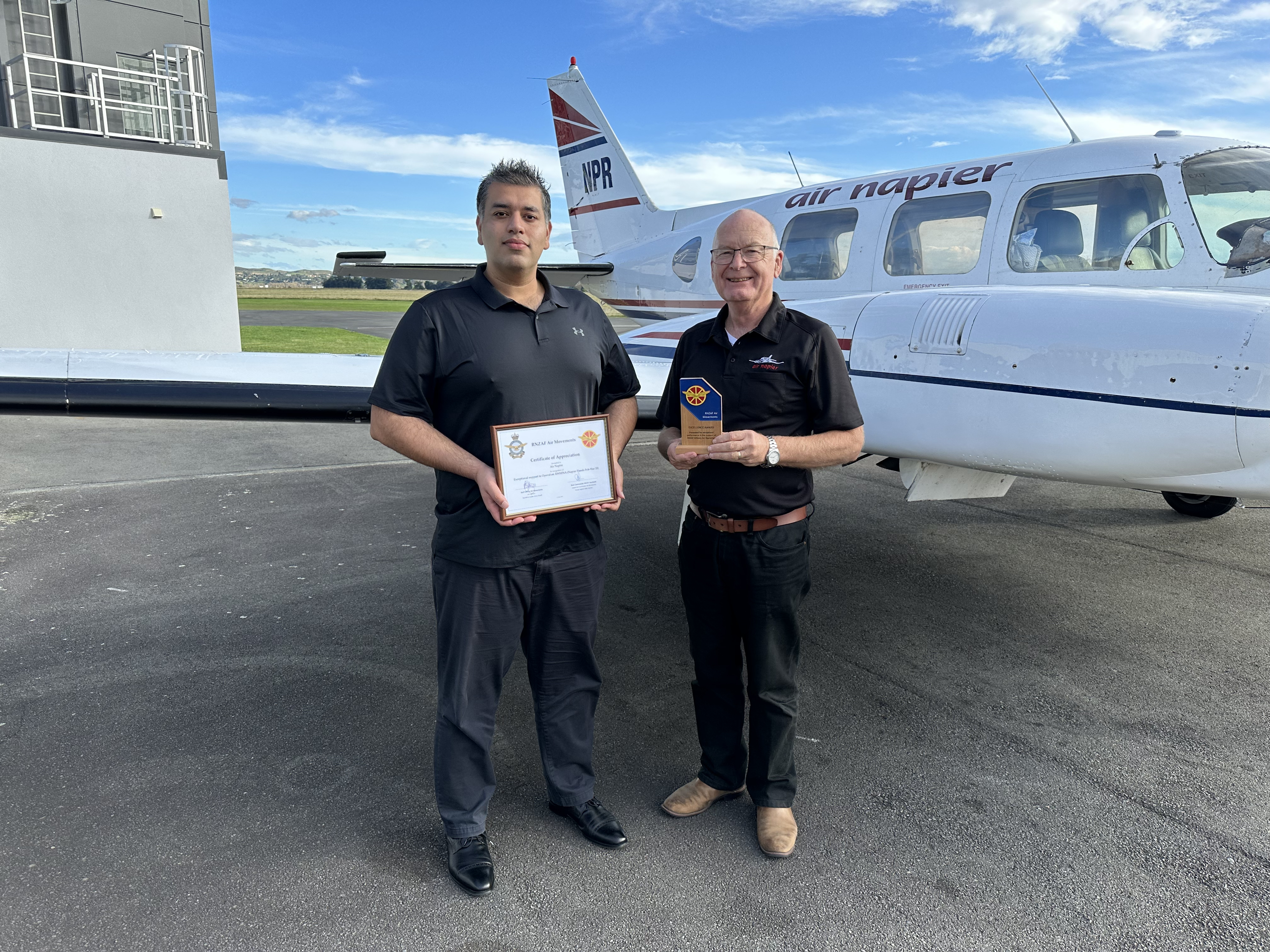 Air Napier CEO Shah Aslam (Left) and operations director John Hamilton received an award on Monday for the airline's service during the Napier floods.