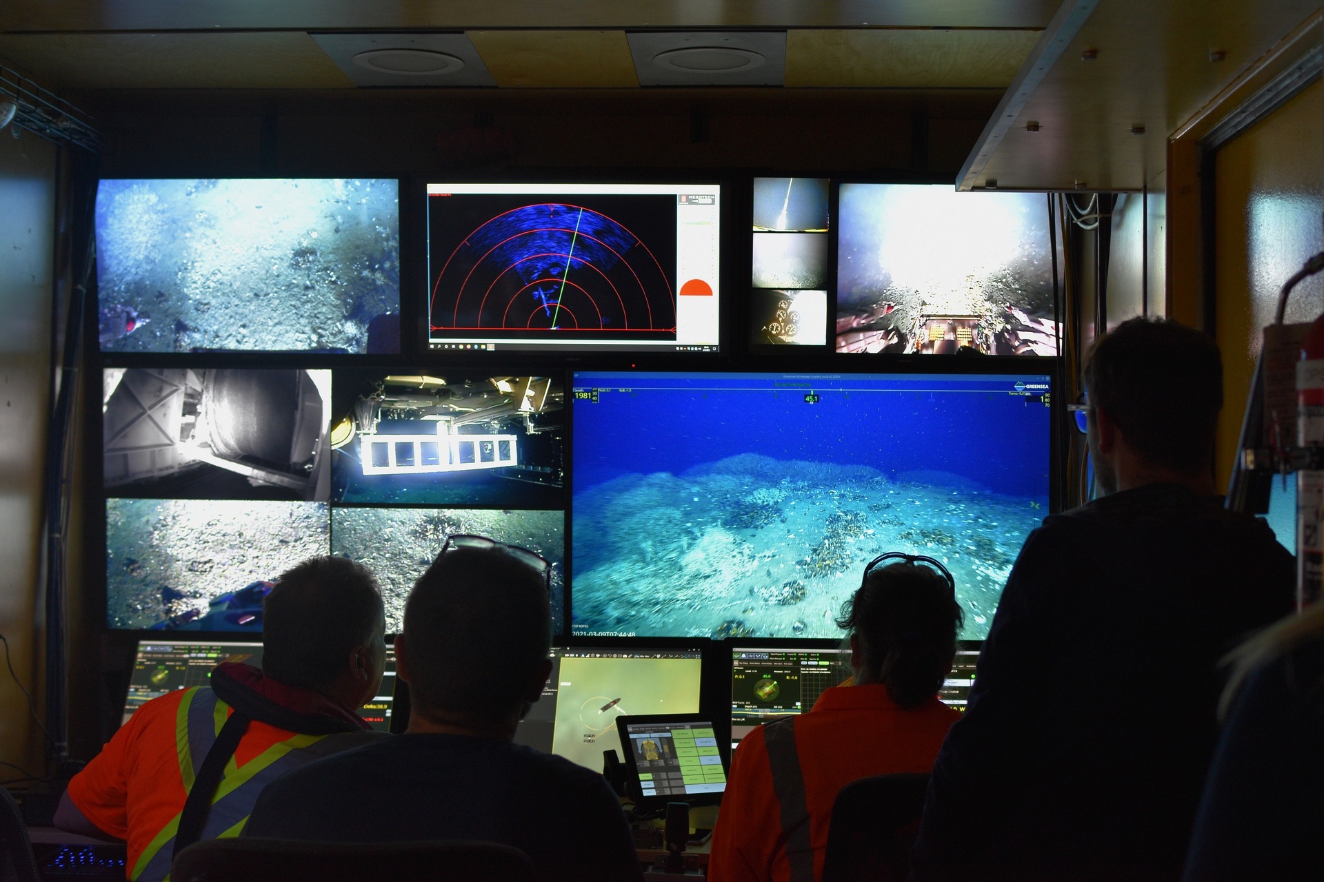 Scientists aboard the Niwa vessel Tangaroa watch a live feed from the ROPOS remotely operated vehicle as it moves through the ocean in March. Photo / Dr Jess Hillman, GNS Science