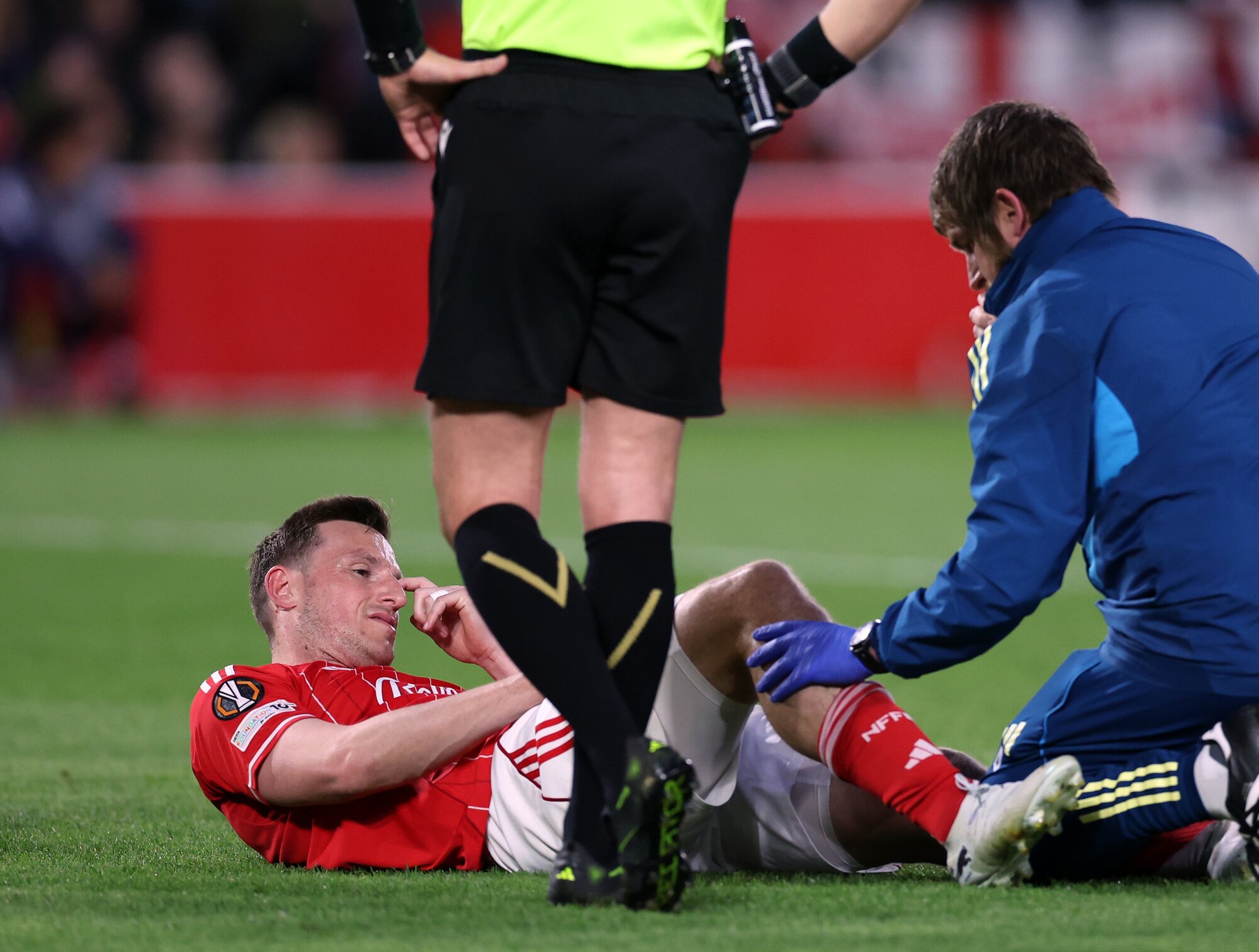 Chris Wood receiving medical treatment after being on the receiving end of a dangerous tackle against Porto. Photo / Getty Images 
