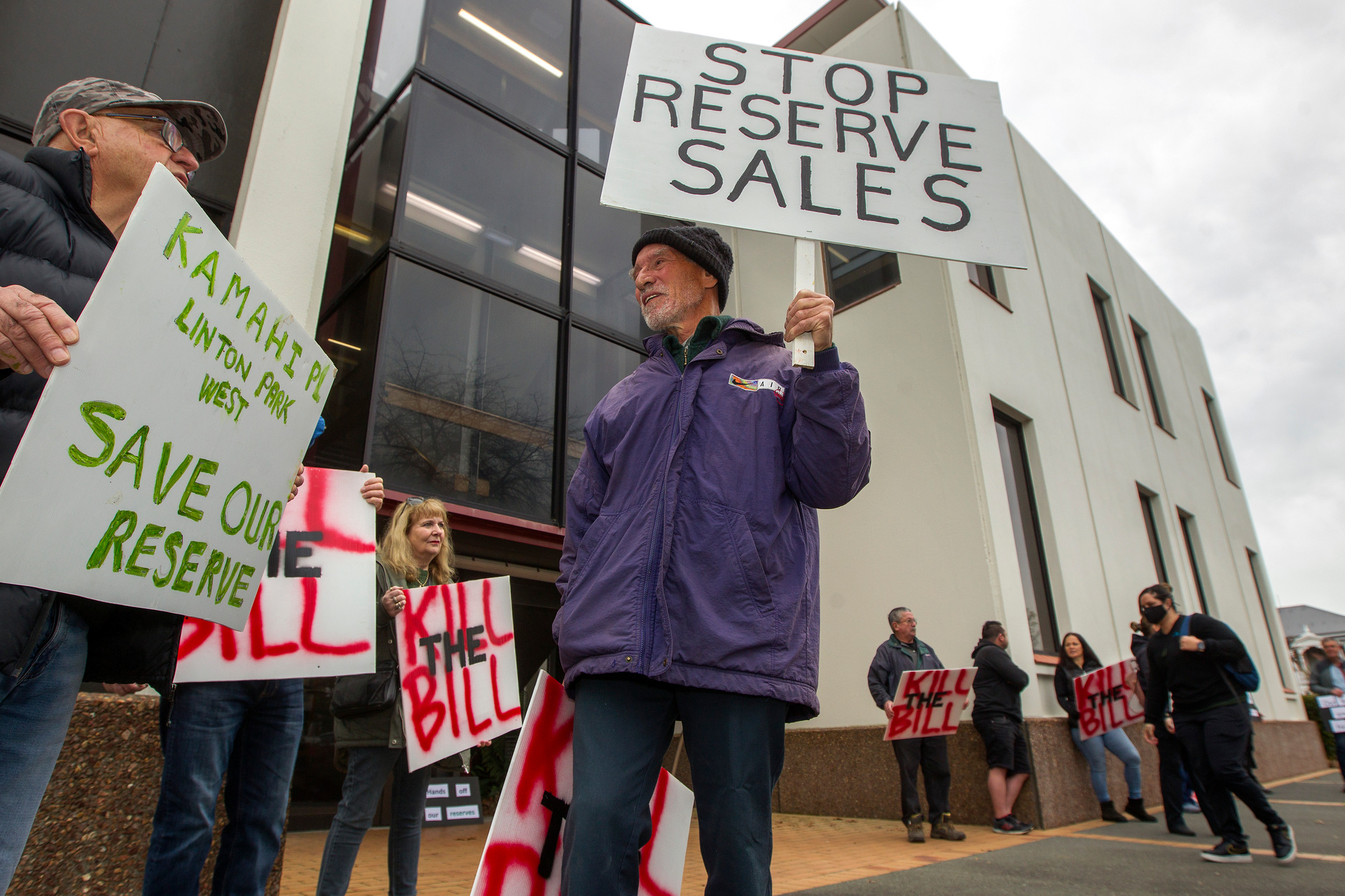 Protesters gather outside the council buildings ahead of the council meeting when the fate of the reserves will be decided. Photo / Ben Fraser