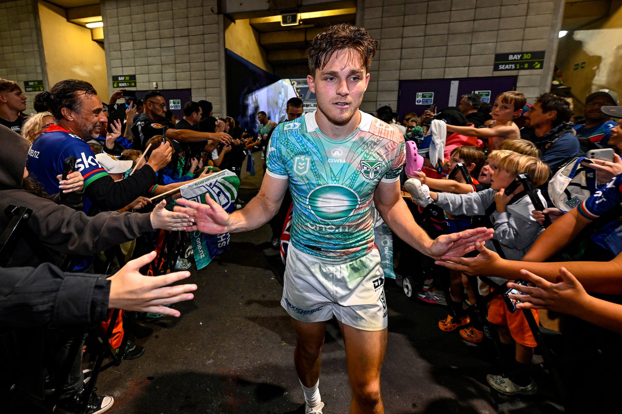 Luke Metcalf is greeted by Warriors supporters. Photo / Photosport