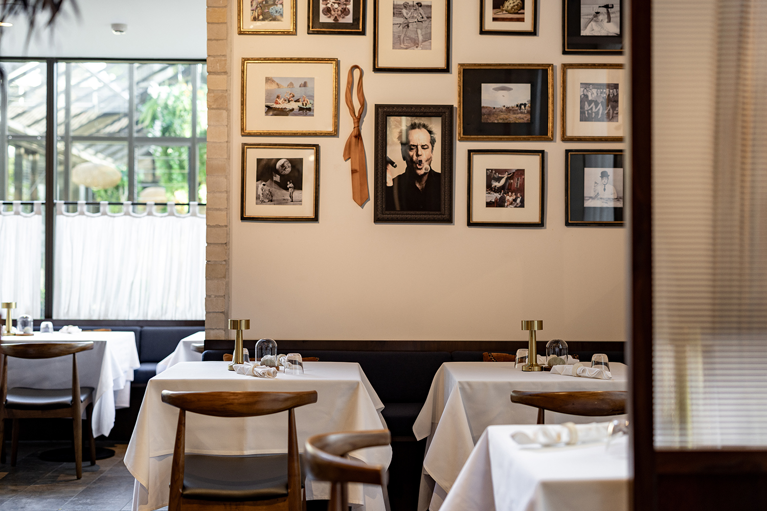 Remuera steakhouse Manzo is decorated traditionally, with white tablecloths and dark wood trimmings. Photo / Babiche Martens