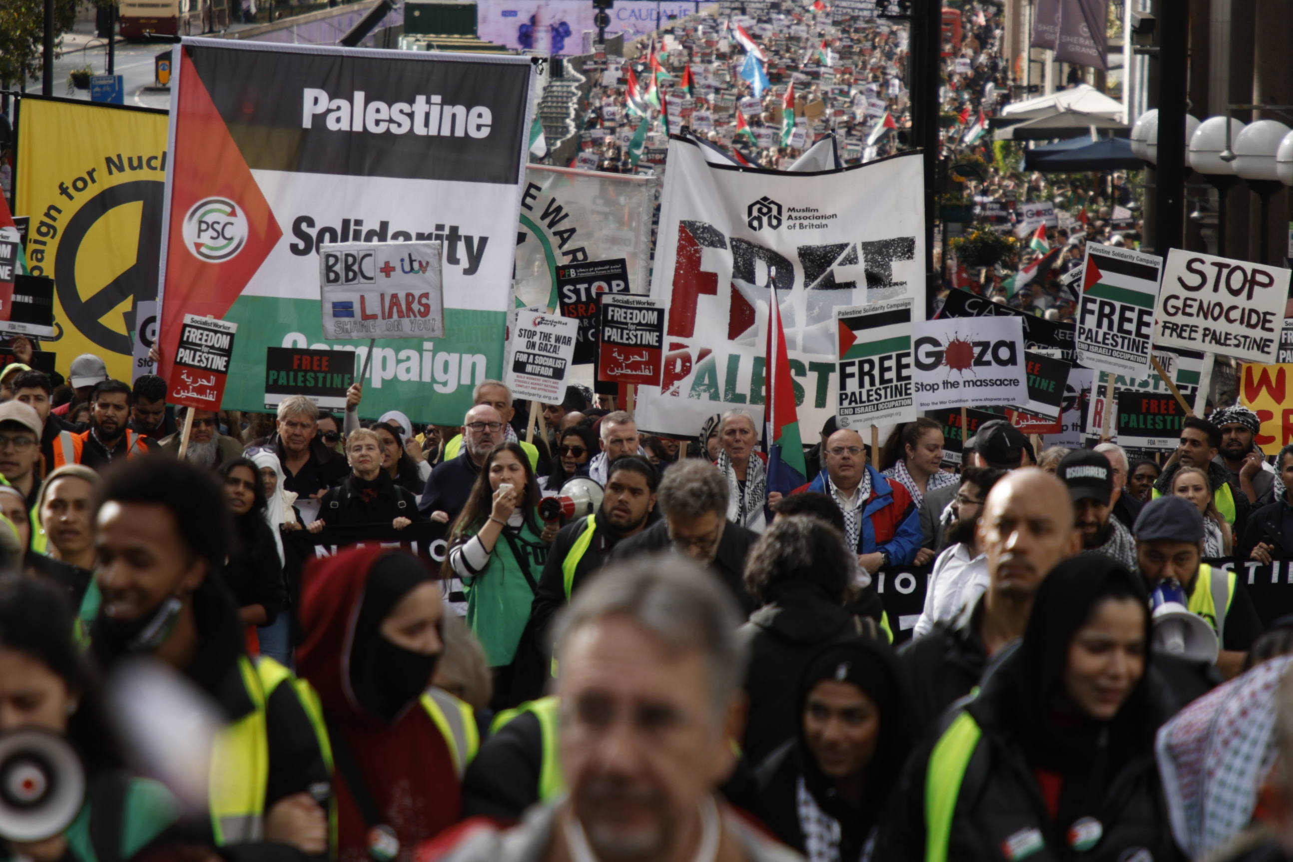 Demonstrators hold up flags and placards during a pro-Palestinian demonstration in London. Photo / AP