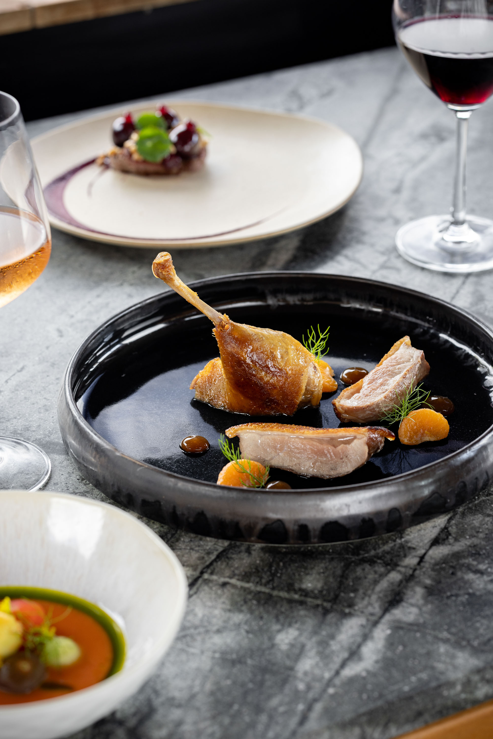 Seared duck breast and confit leg with mandarin at Piha restaurant Aryeh. Photo / Babiche Martens