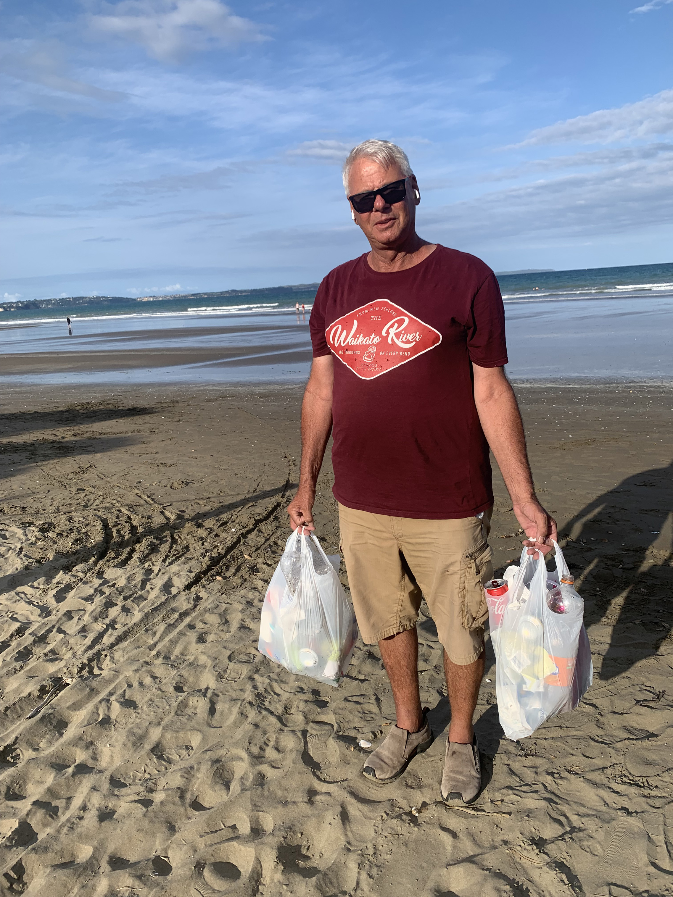 Phillip Oxenius hard at work collecting rubbish at Long Bay.