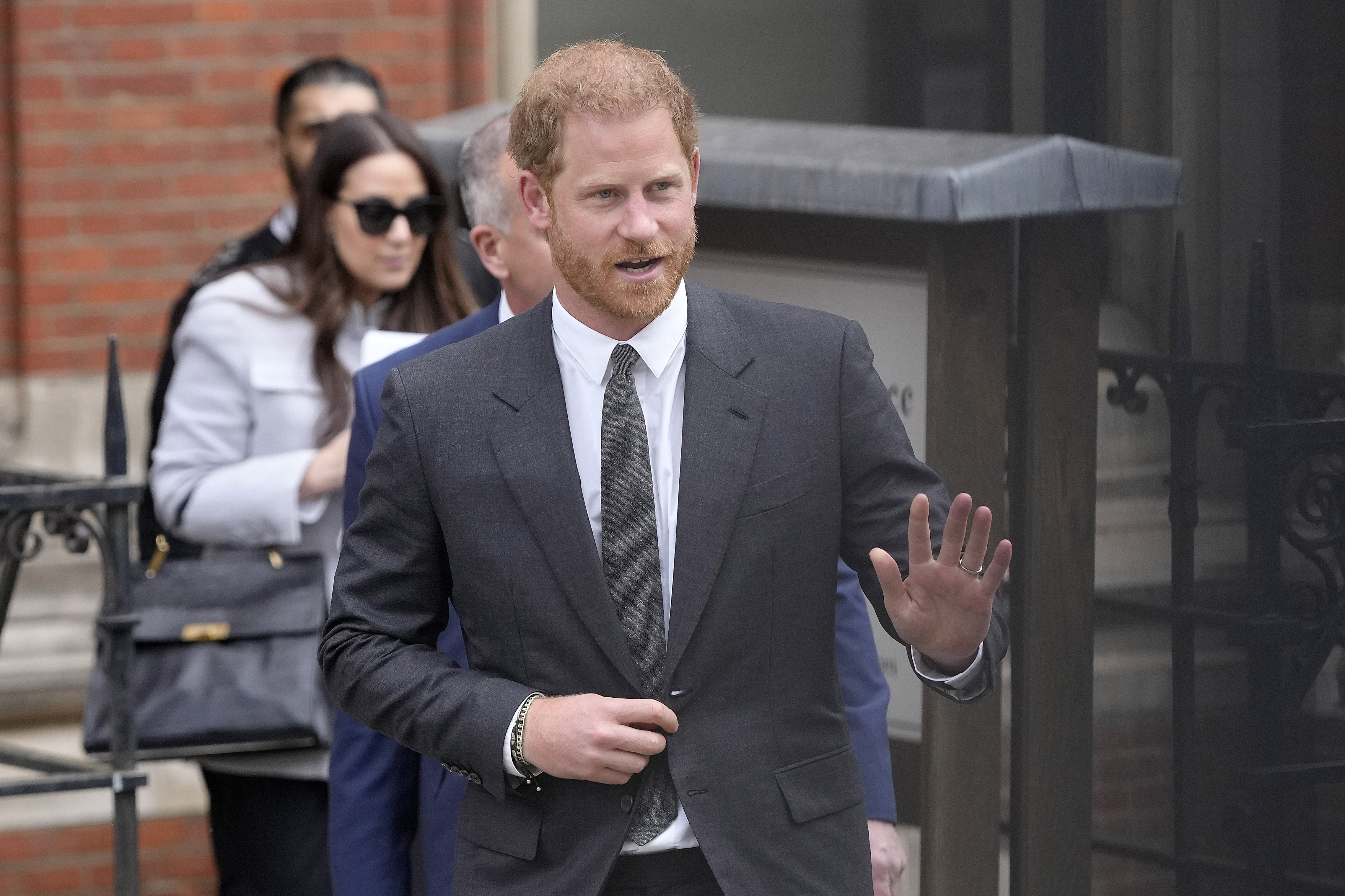Prince Harry waves as he leaves the Royal Courts Of Justice in London. His lawyers said he will probably testify in early to mid-June. Photo / AP