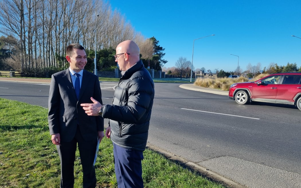 Transport Minister Simeon Brown (left) and Waimakariri MP Matt Doocey at the Pegasus roundabout. Photo / RNZ, Rachel Graham