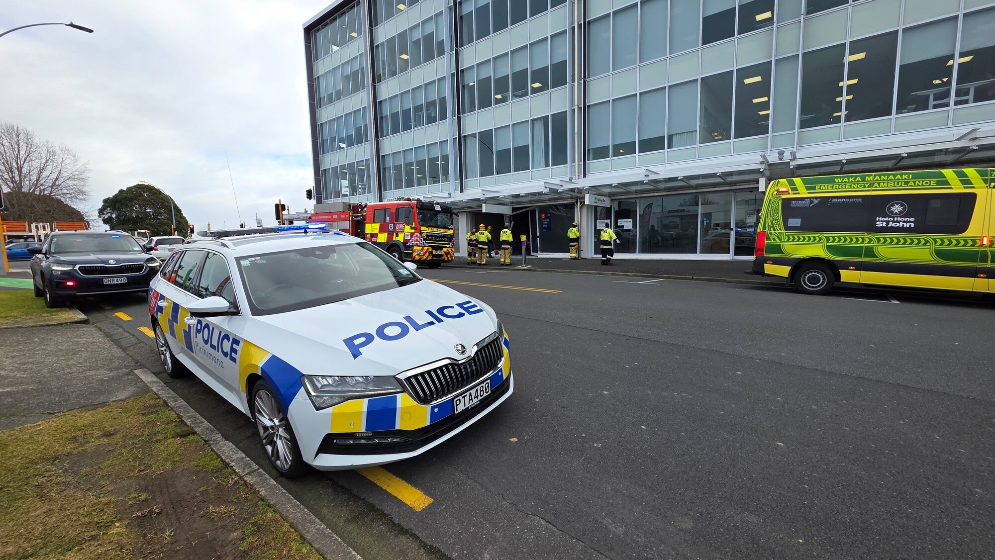  Emergency services had to help a seriously injured person get out of a car after it crashed into a building on 3rd Ave, Tauranga. Photo / Cameron Avery