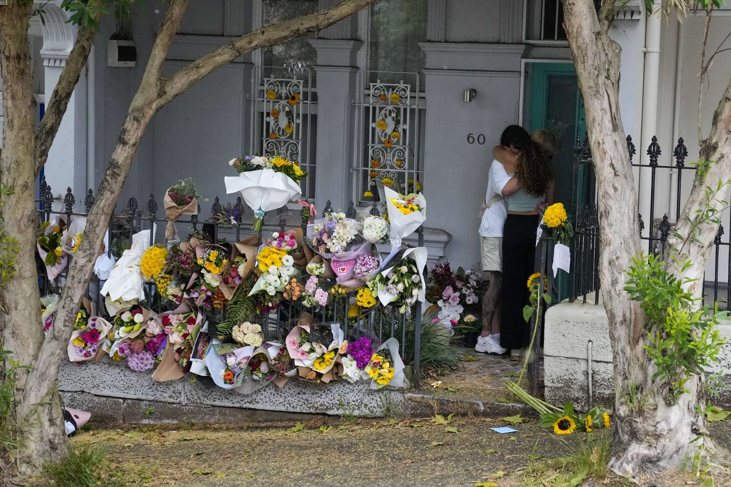 A couple embrace at the Paddington residence of Jesse Baird in Sydney, Tuesday, Feb. 27, 2024. Photo / AP