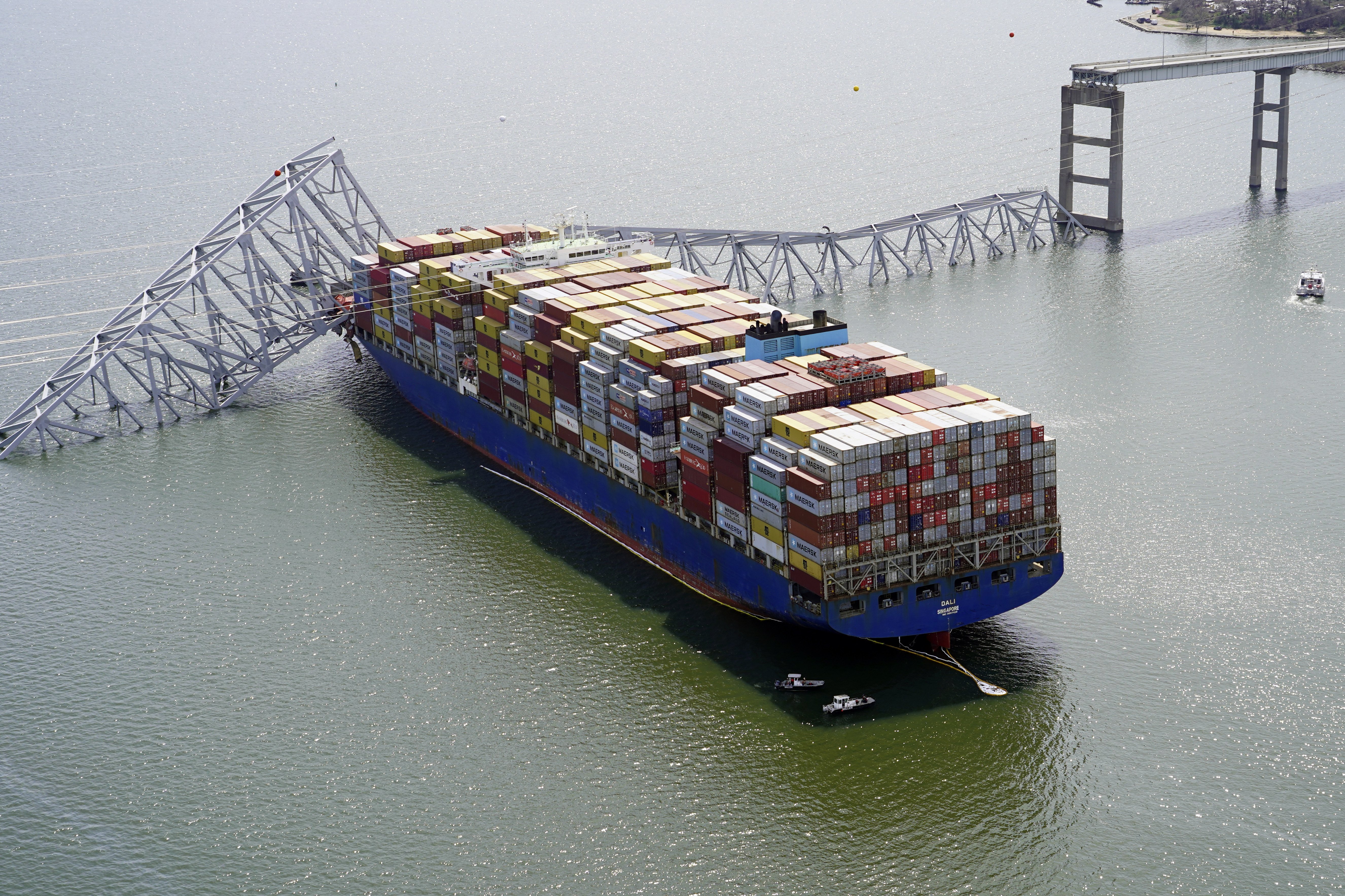 The cargo ship Dali is stuck under part of the structure of the Francis Scott Key Bridge after the ship hit the bridge in Baltimore last month. Photo / AP