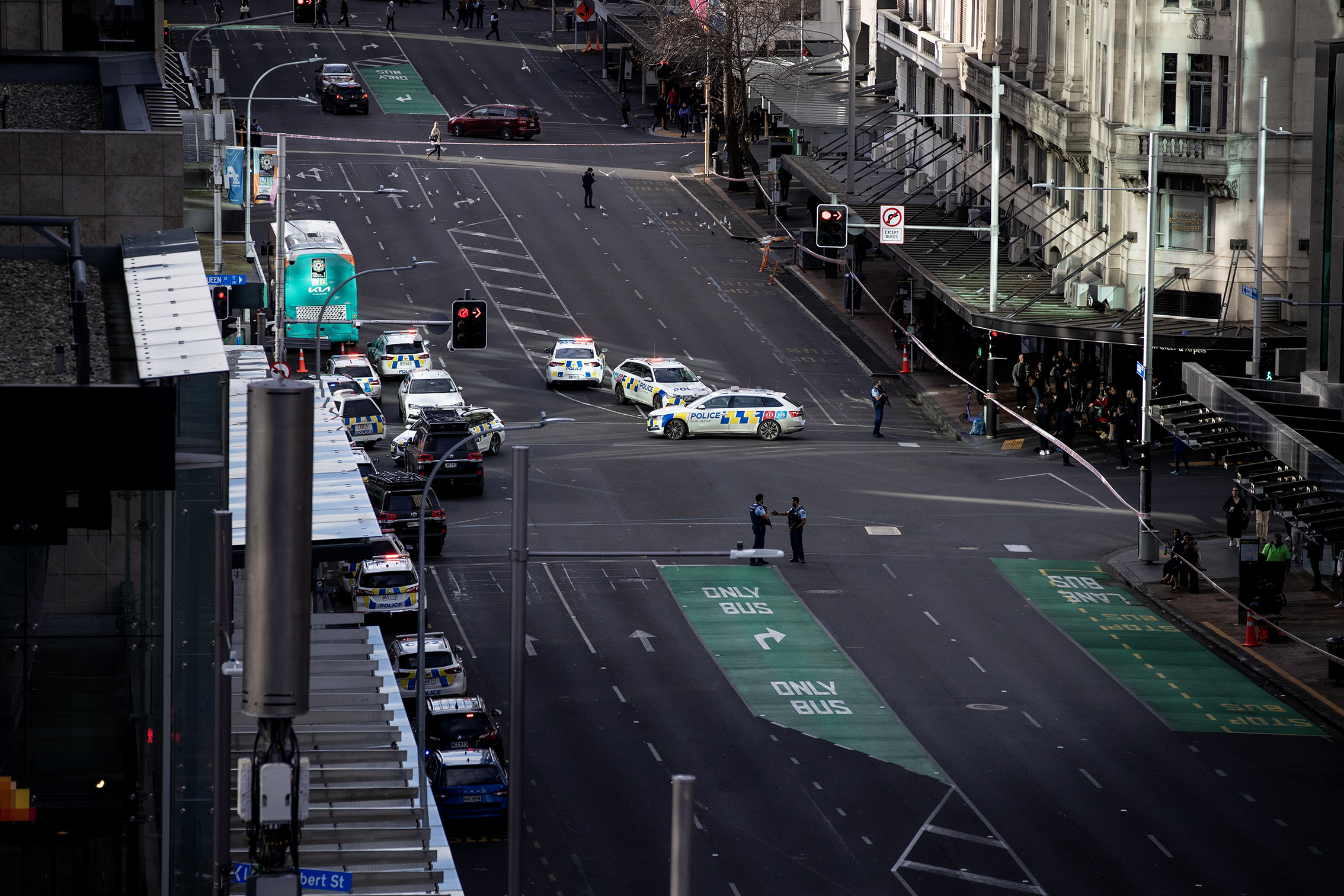 Police blocked Customs St East in downtown Auckland as police dealt with an active shooter. Photo / Hayden Woodward