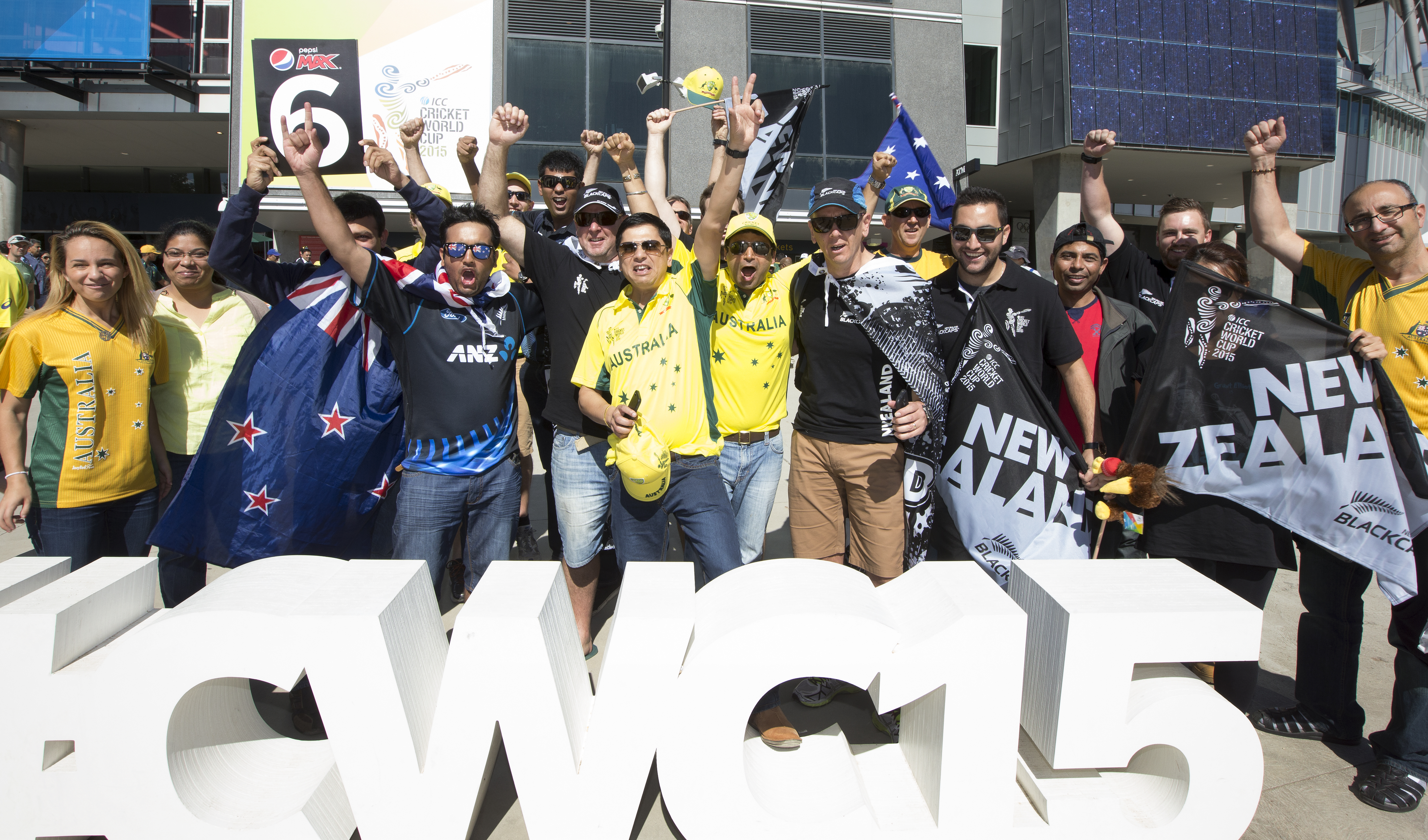 For the love of the game: Australia and Black Cap fans pose together outside the MCG.