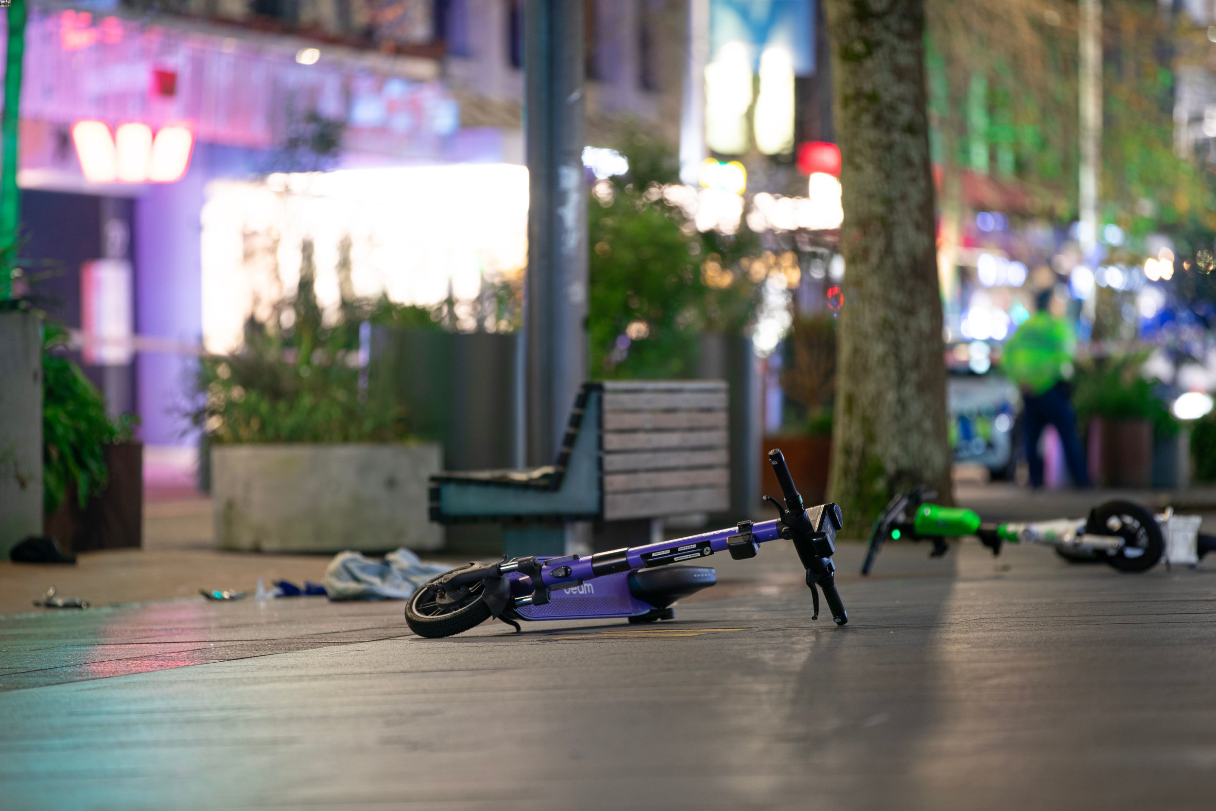 Electric scooters abandoned on lower Queen St following a shooting incident at 11.30pm on August 3. Photo / Hayden Woodward