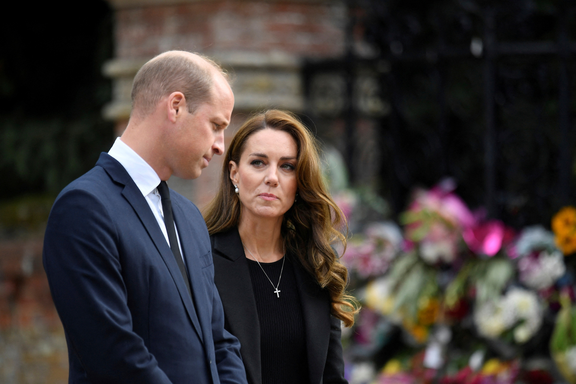 Britain's William, Prince of Wales and Kate, Princess of Wales view floral tributes. Photo / AP