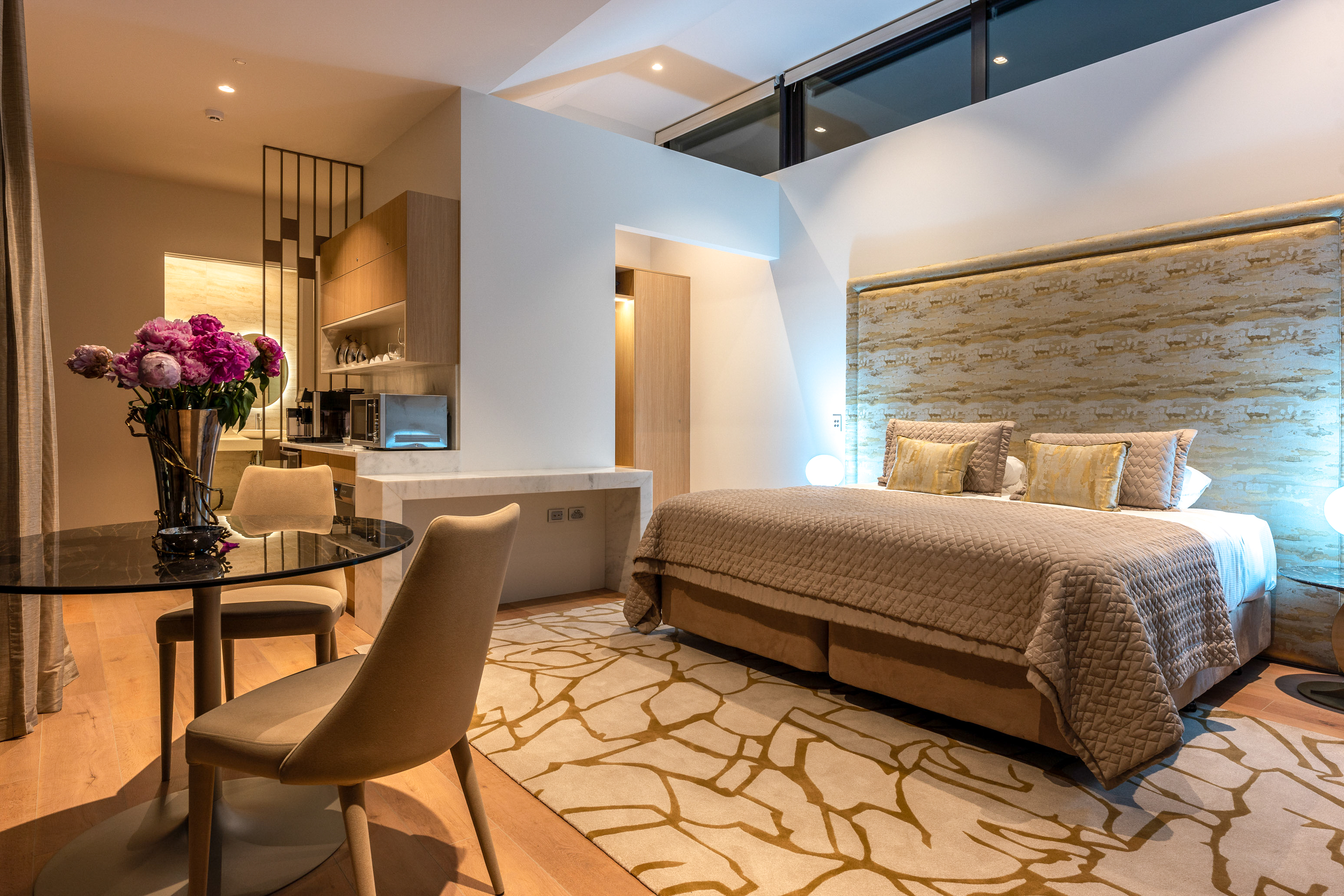 The Serenity villa at Omana Luxury Villa on Waiheke Island is decorated in warm golds. Photo / Supplied