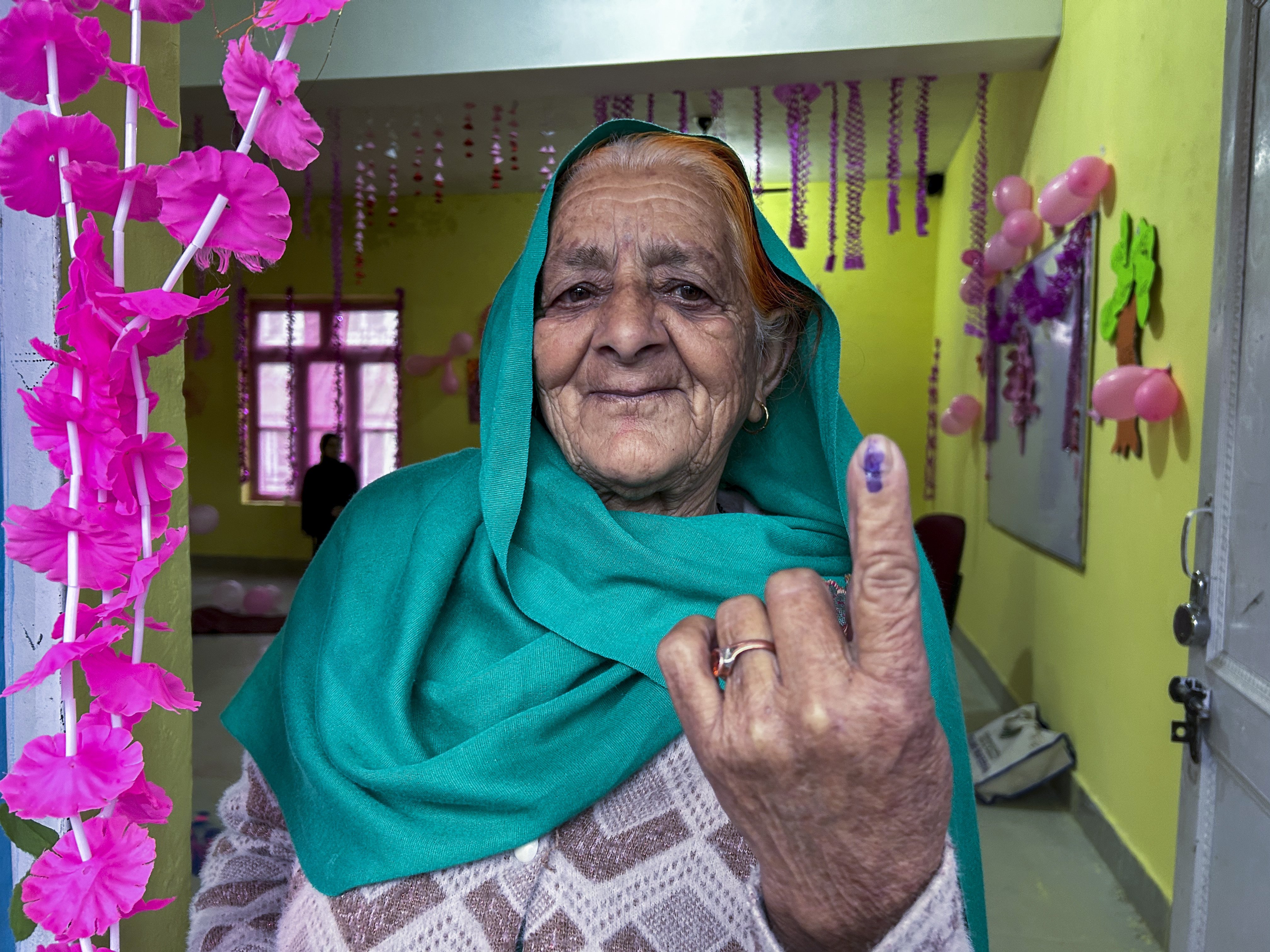 A woman shows the indelible ink mark on her finger after casting her vote during the first round of polling of India’s national election in Doda district, Jammu and Kashmir, India. Photo / AP