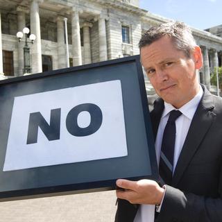 One News political editor Guyan Espiner with Winston Peter's famous NO sign. Photo / Mark Mitchell