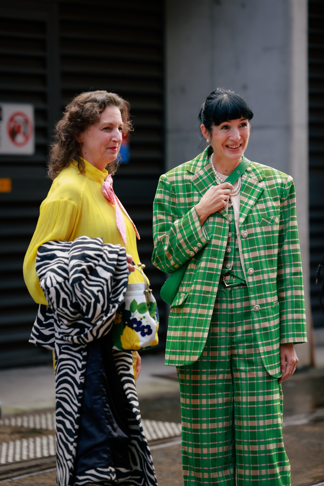 These two attendees showed different approaches, one matching prints, the other preferring a vibrant clash. Photo / Hanna Lassen, Getty Images