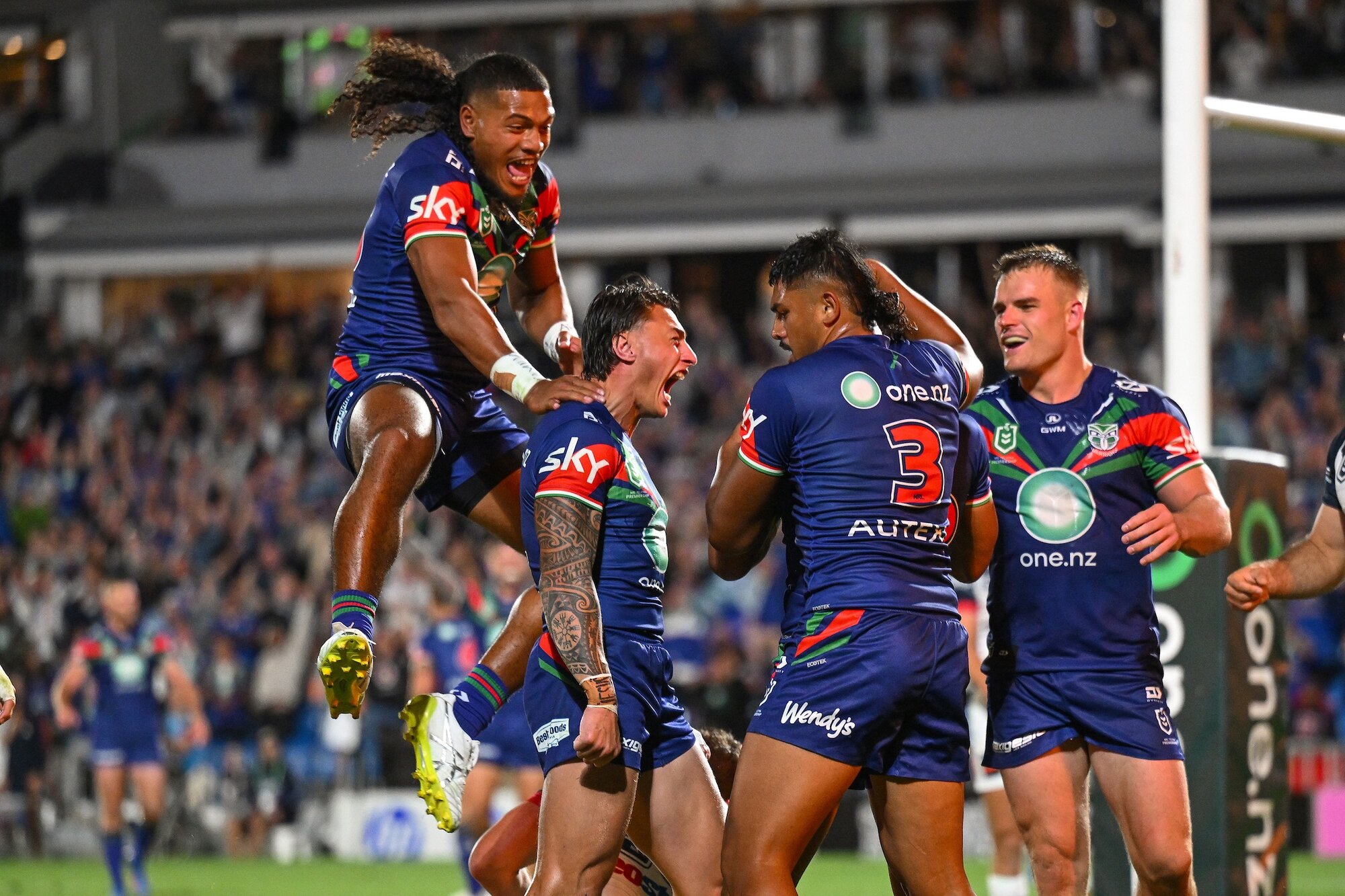 New Zealand Warriors players celebrate a try from Leka Halasima during their opening round win against the Sydney Roosters at Go Media Stadium, Auckland, on Friday. Photo / Photosport