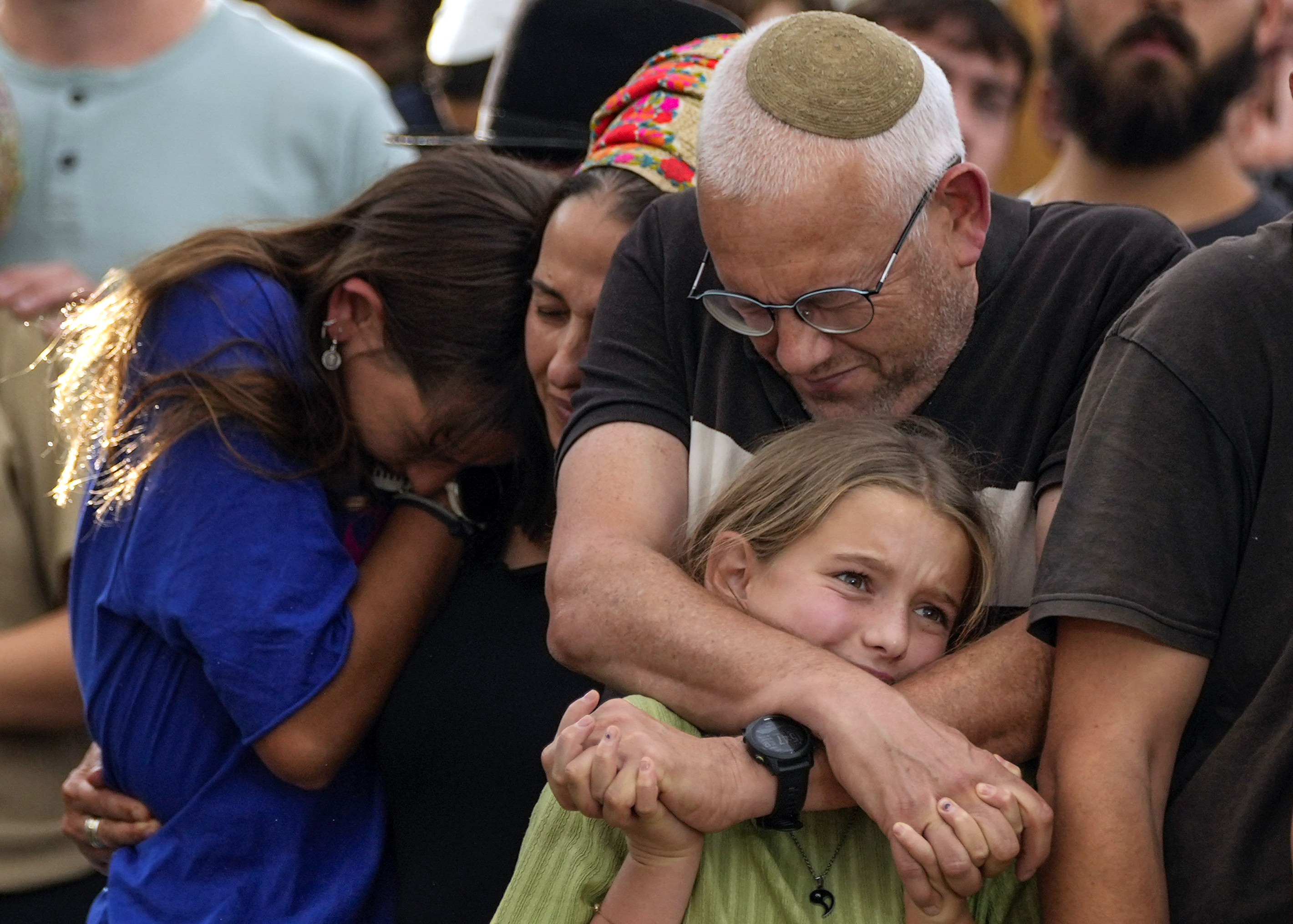Family members mourn during the funeral of Israeli soldier Shilo Rauchberger. Photo / AP